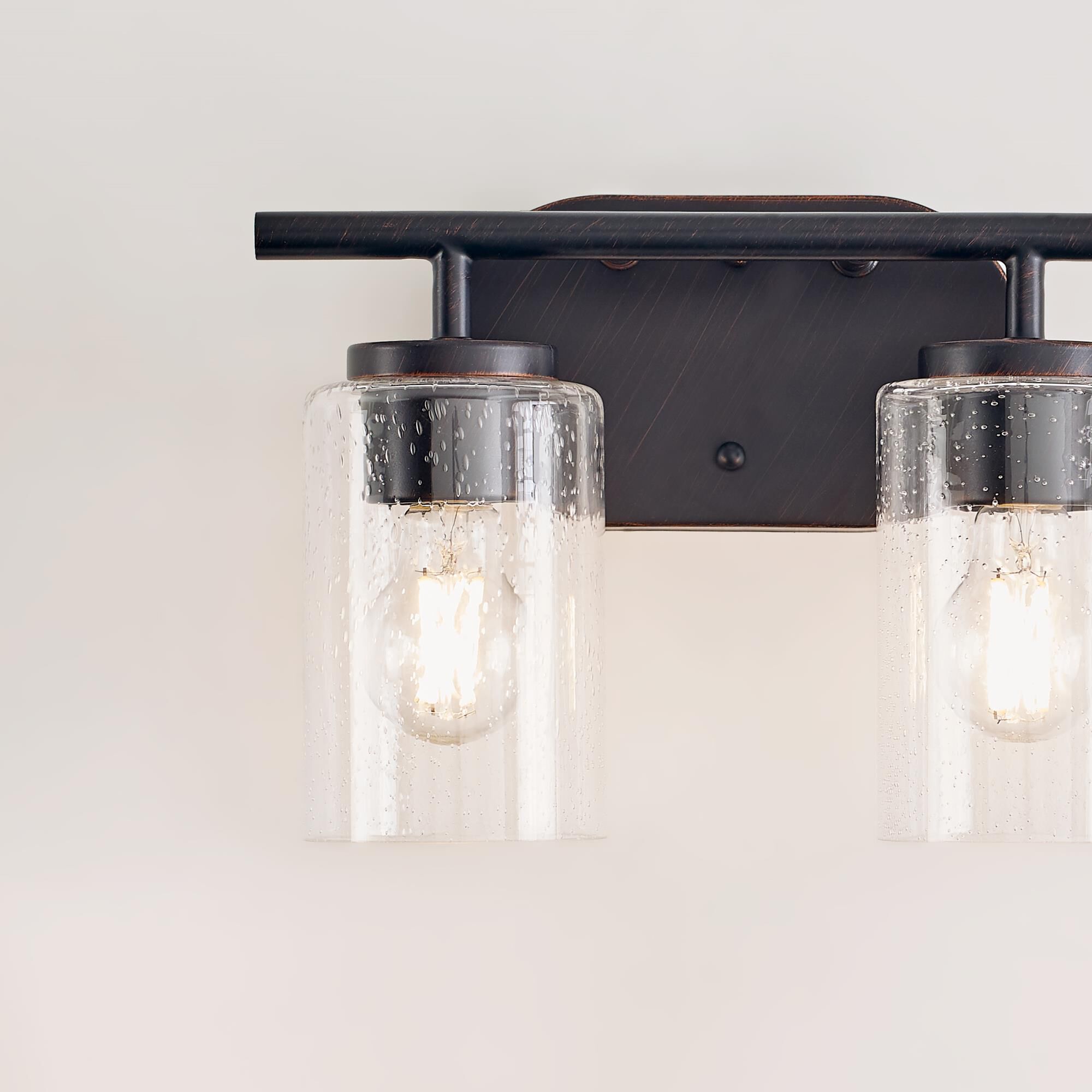 Shown in Bronze finish and Clear Seeded glass