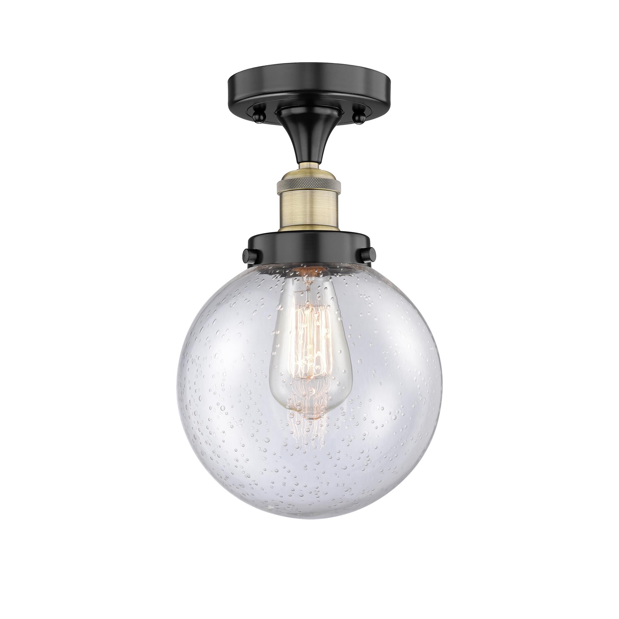 Shown in Black Antique Brass finish and Seedy glass