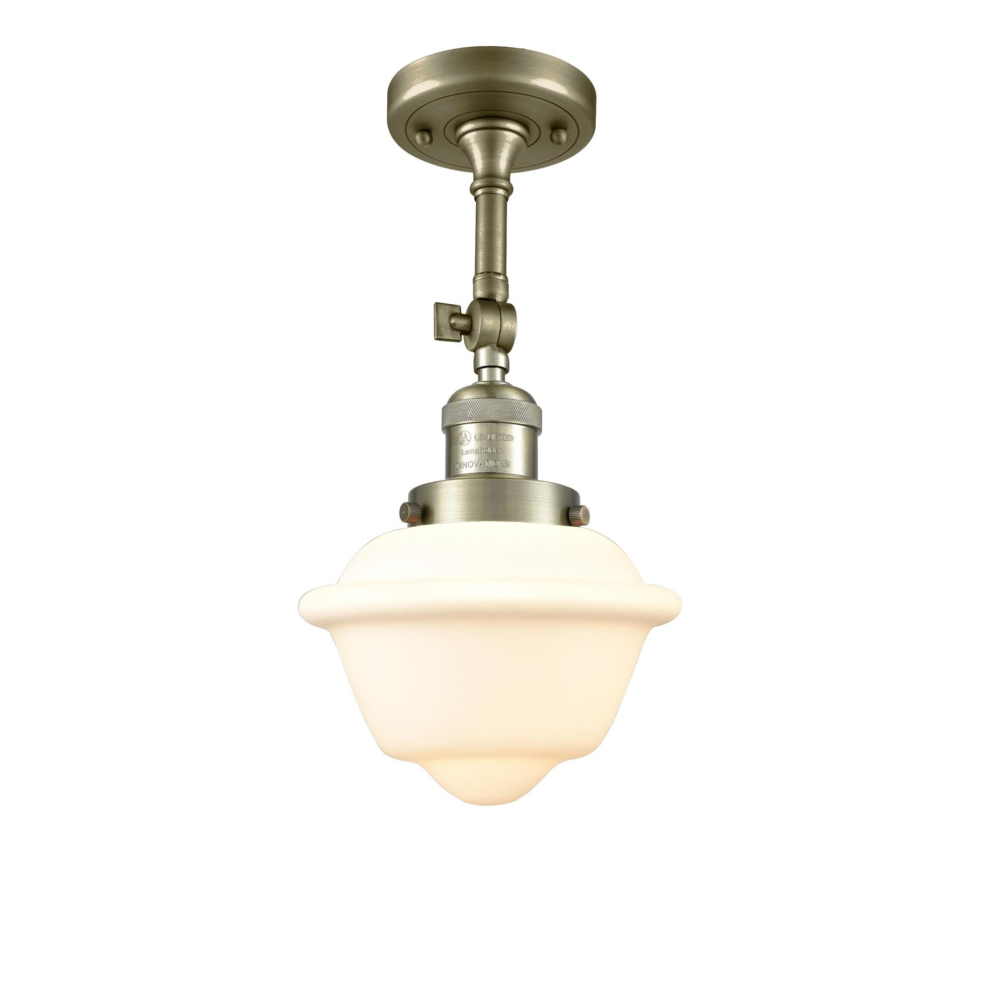 Shown in Antique Brass finish and Matte White Cased glass