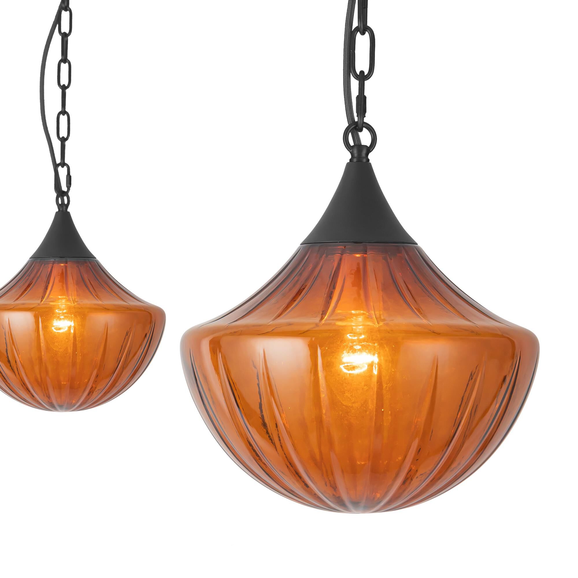 Shown in Matte Black finish and Amber Ribbed glass