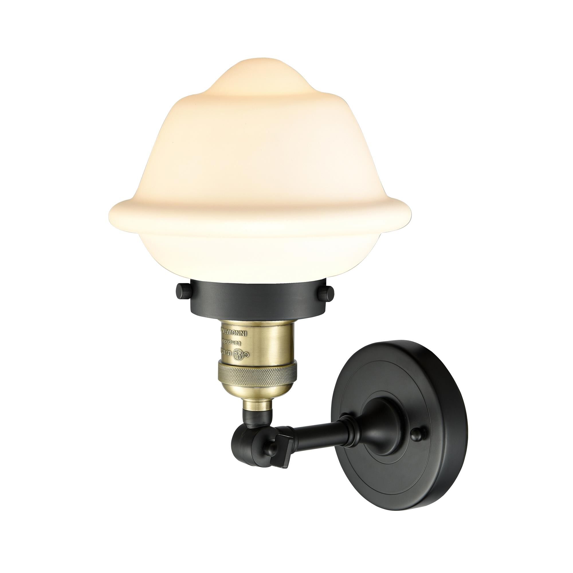 Shown in Black Antique Brass finish and Matte White Cased glass