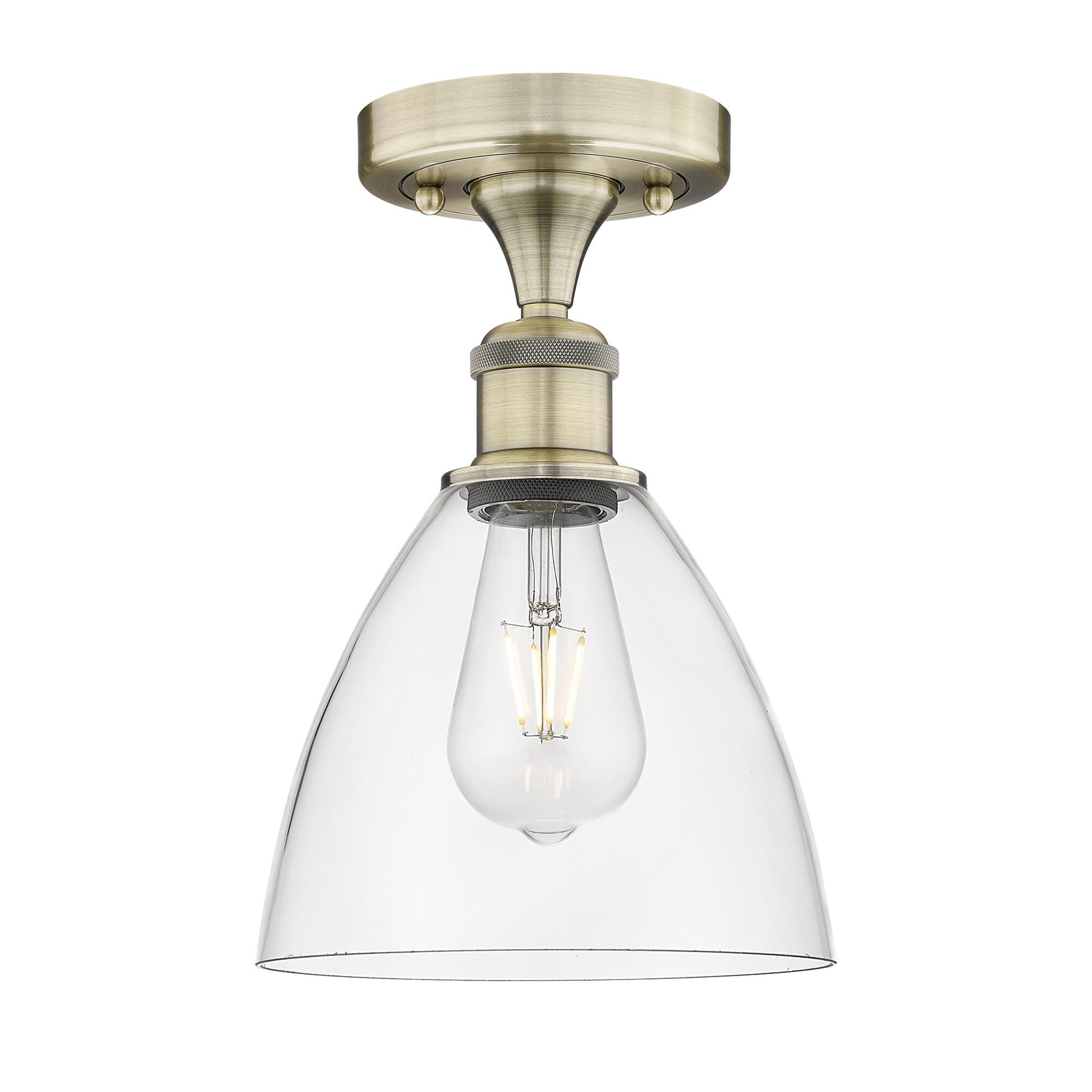 Shown in Antique Brass finish and Clear glass