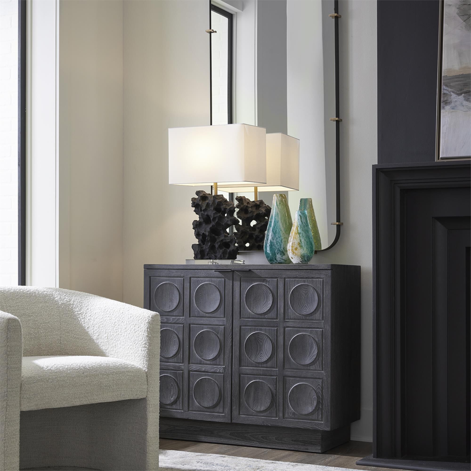 Shown in A Two Door Cabinet Featuring A Striking Carved Circular Design, Constructed From Solid Elm And Elm V finish