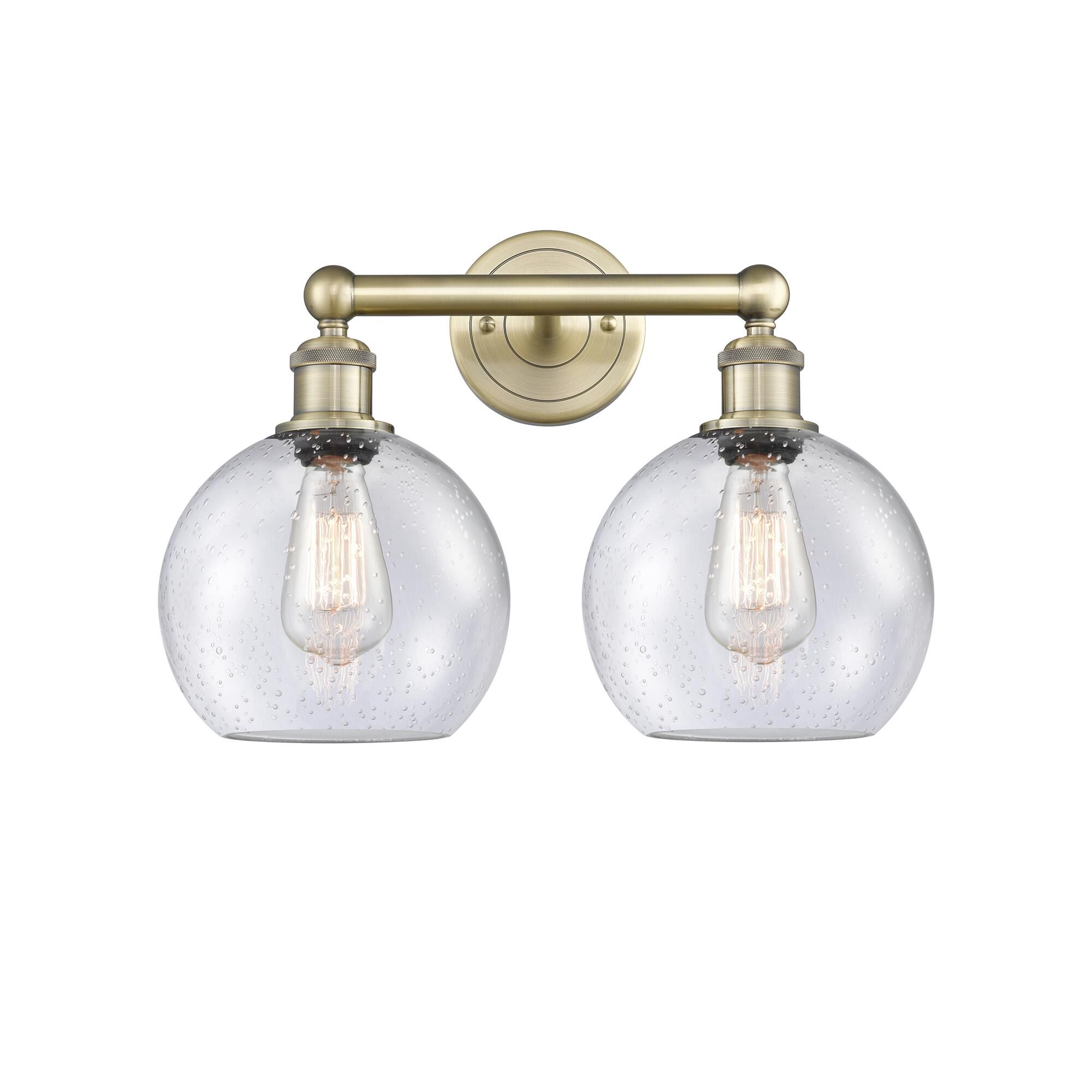 Shown in Antique Brass finish and Seedy glass