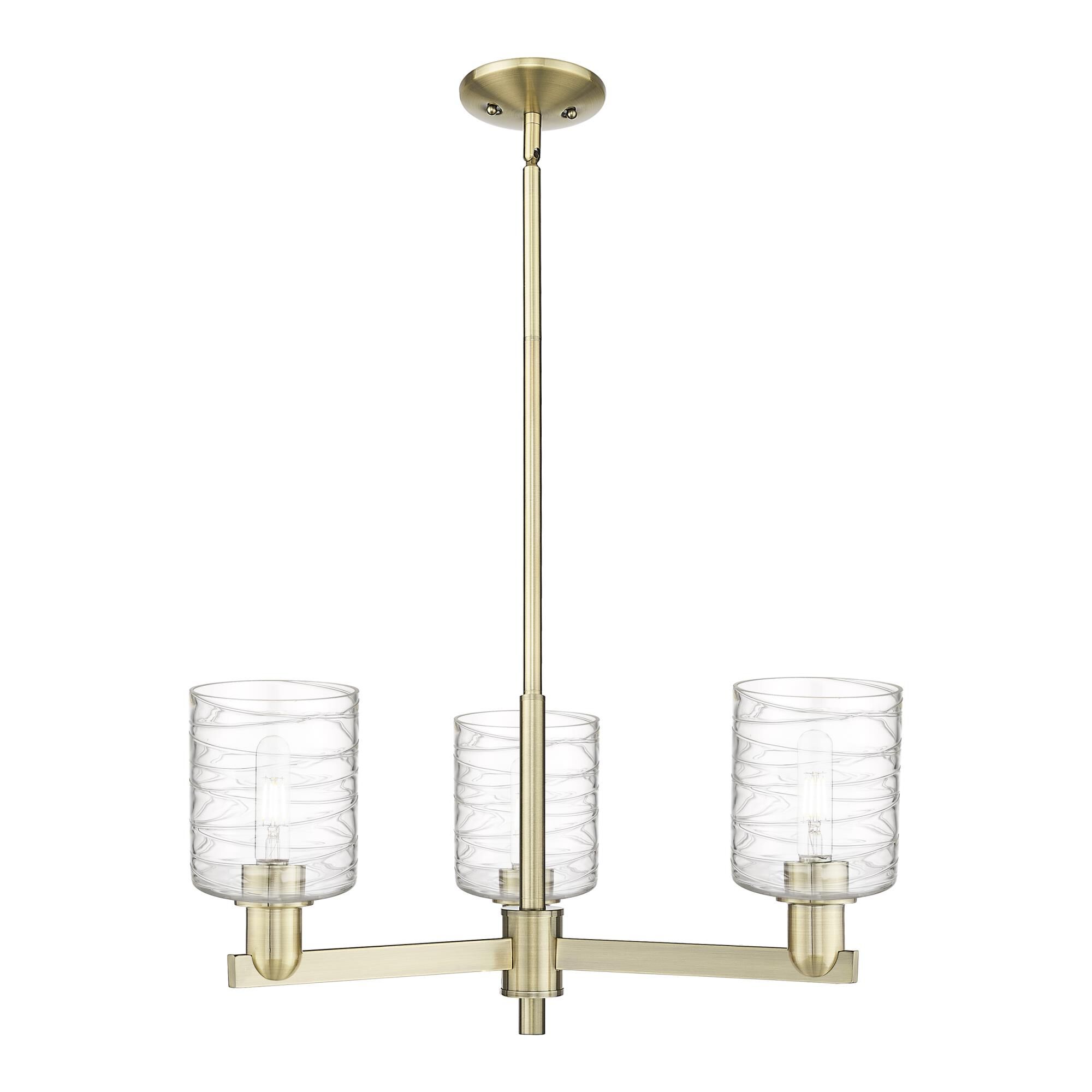 Shown in Antique Brass finish and Deco Swirl glass