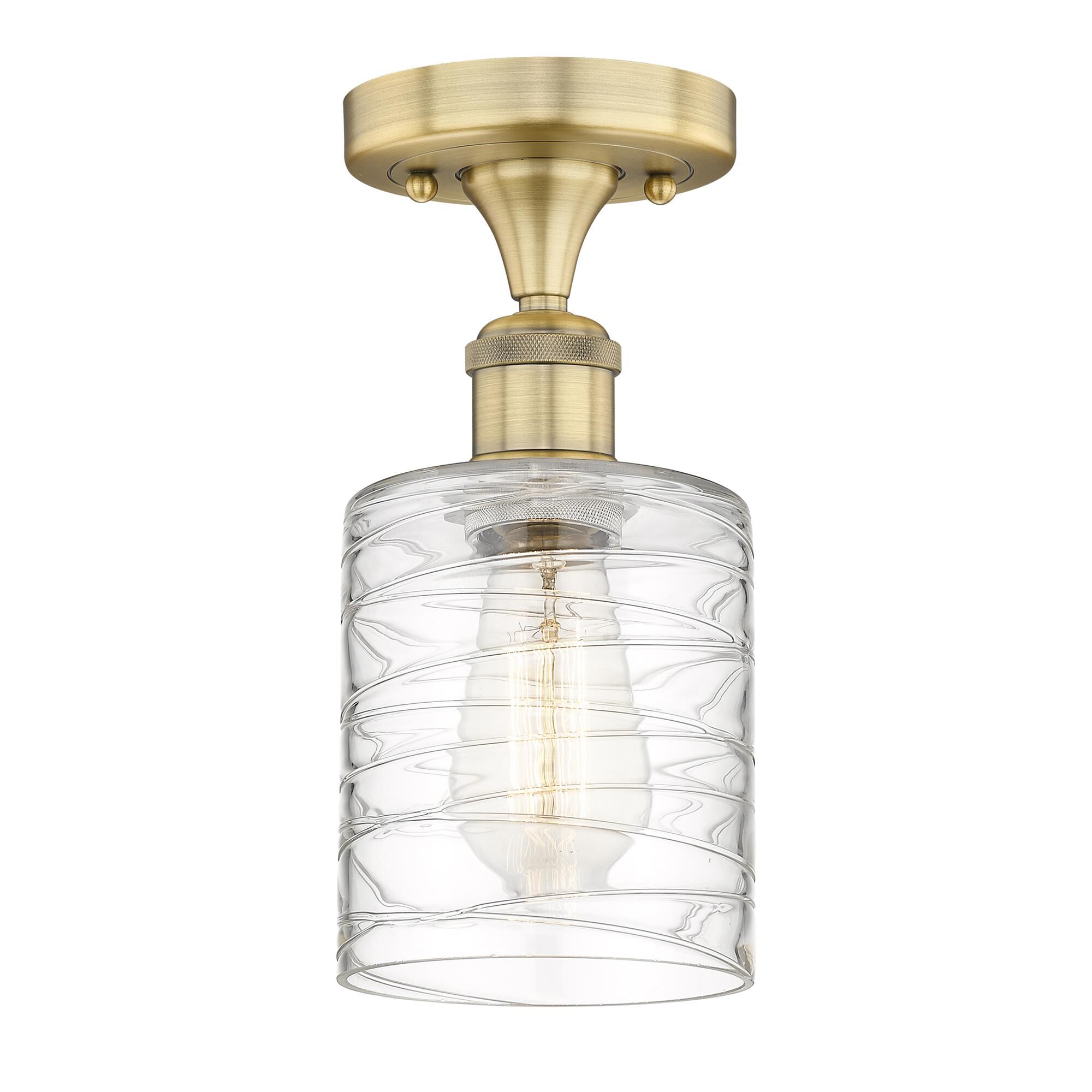 Shown in Brushed Brass finish and Deco Swirl glass