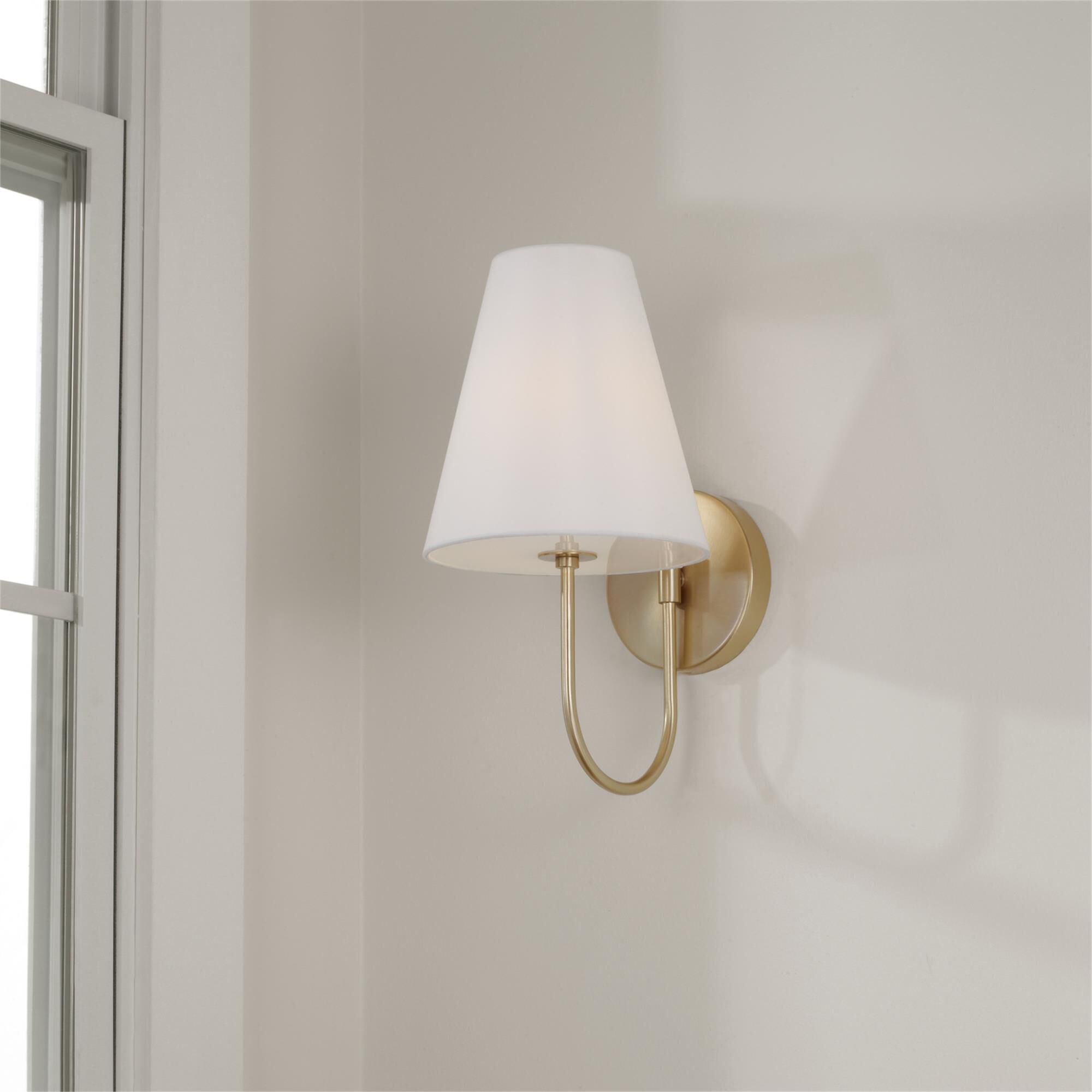 Shown in Matte Brass finish and Soft White Fabric Stay-Straight shade