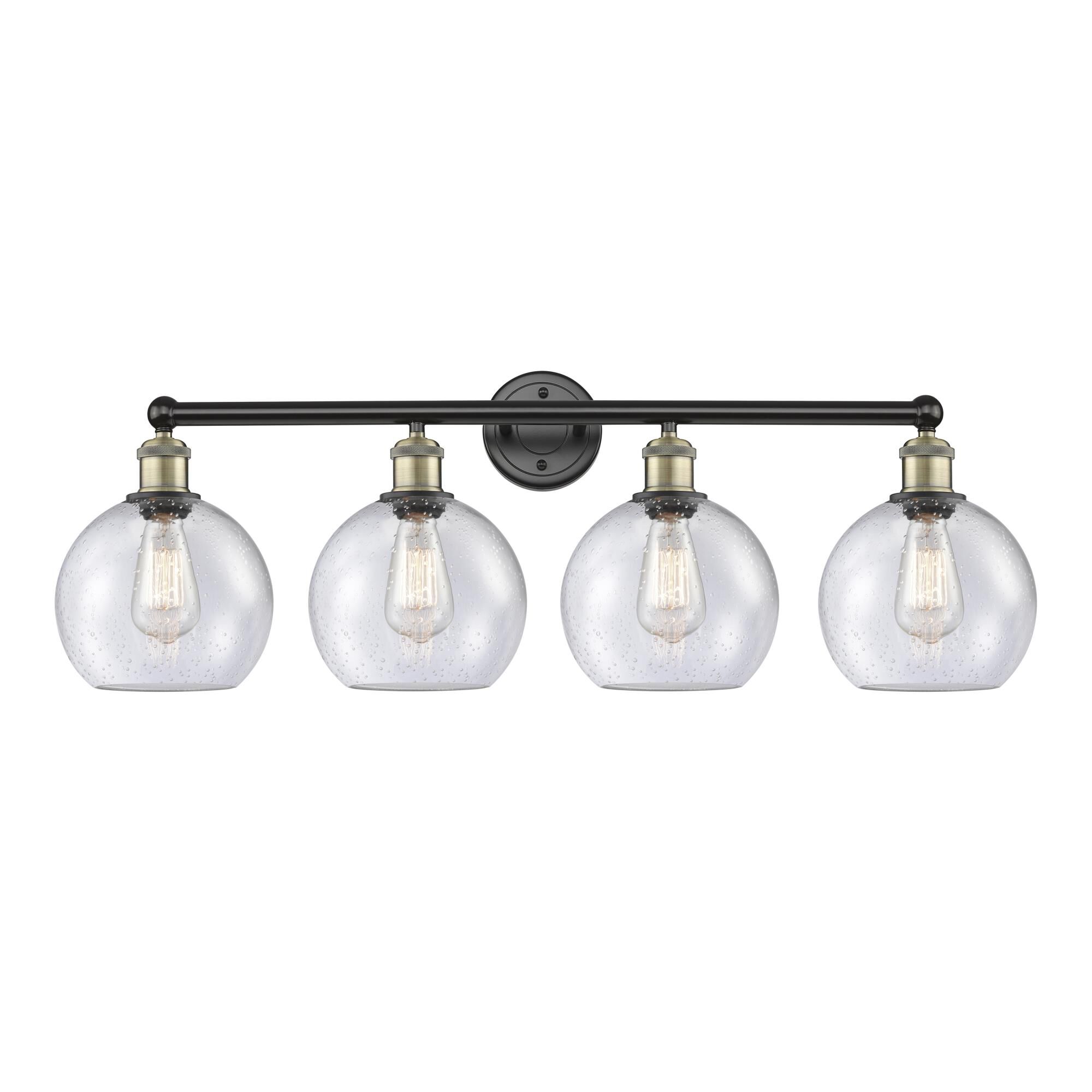 Shown in Black Antique Brass finish and Seedy glass