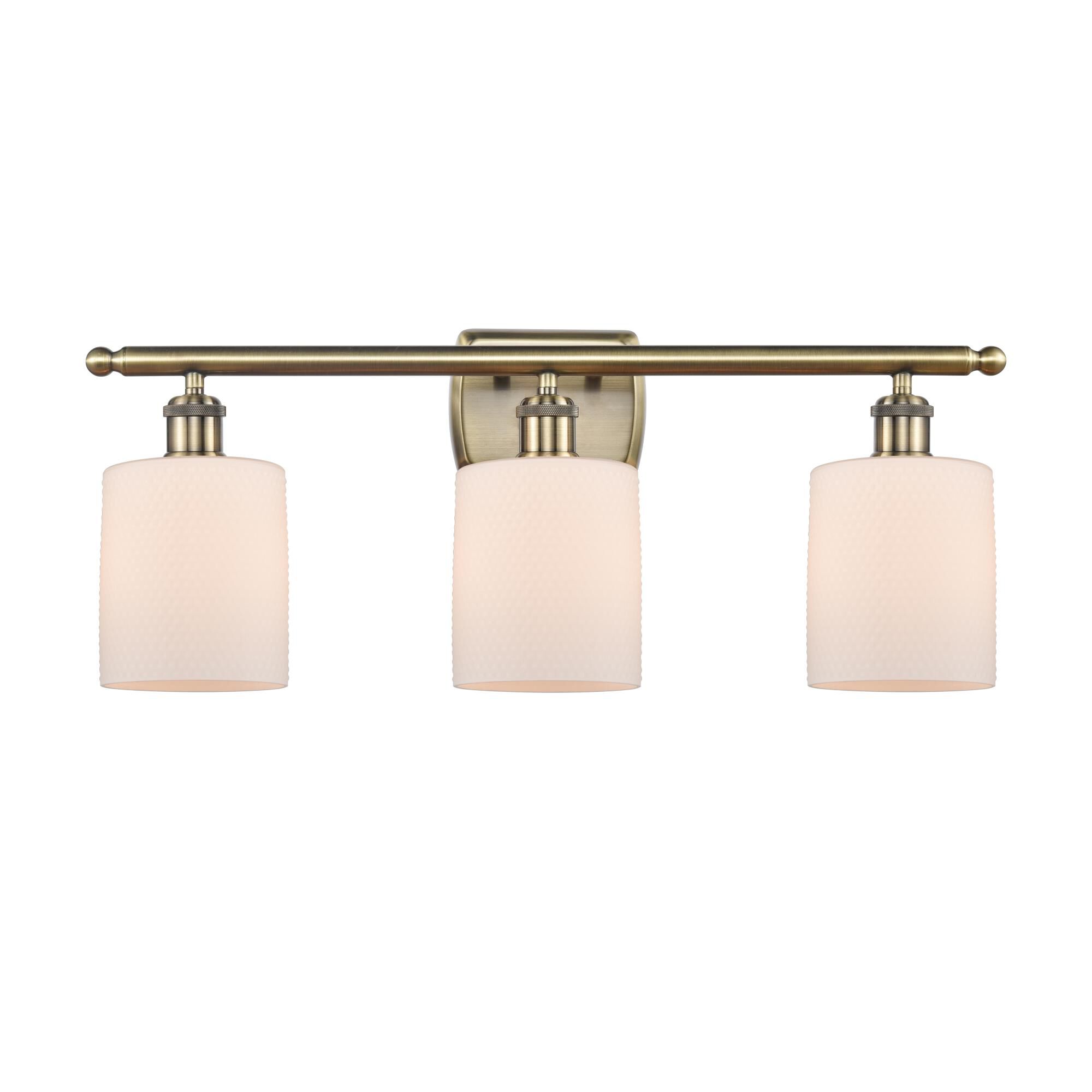 Shown in Antique Brass finish and Matte White Cobbleskill glass and None shade