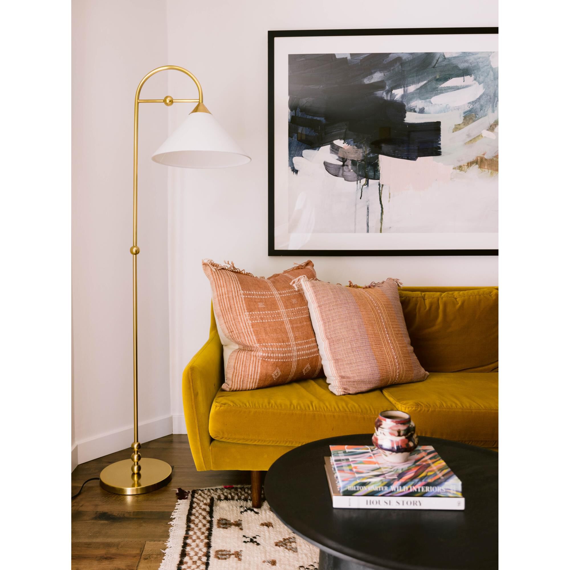 Shown in Aged Brass finish and White Linen shade