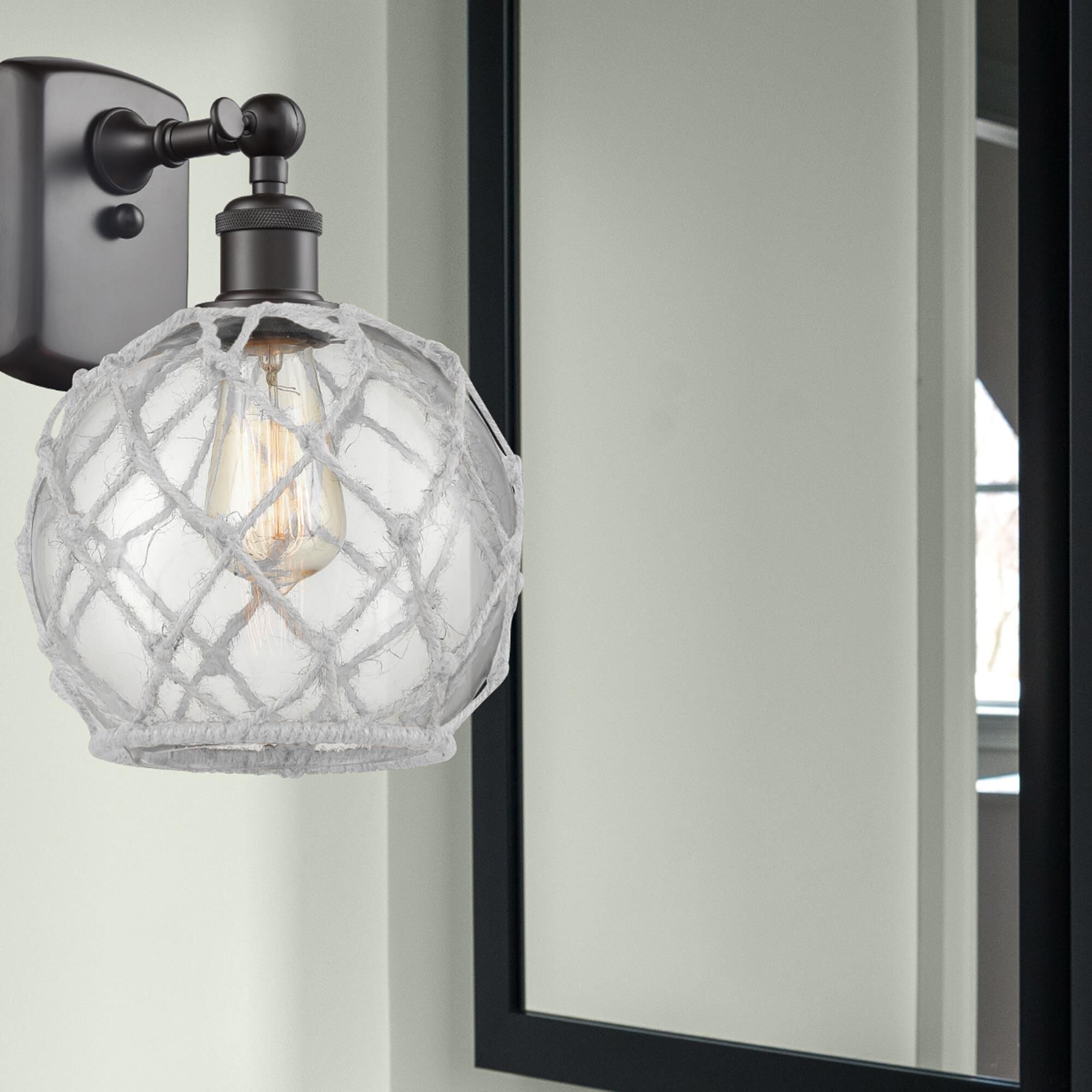 Shown in Oil Rubbed Bronze finish and Clear With White Rope glass