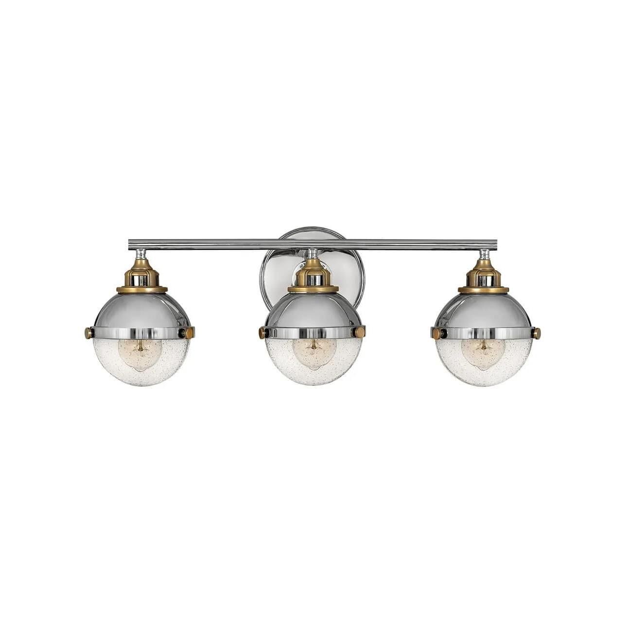Shown in Polished Nickel finish and Clear Seedy glass and Heritage Brass accent