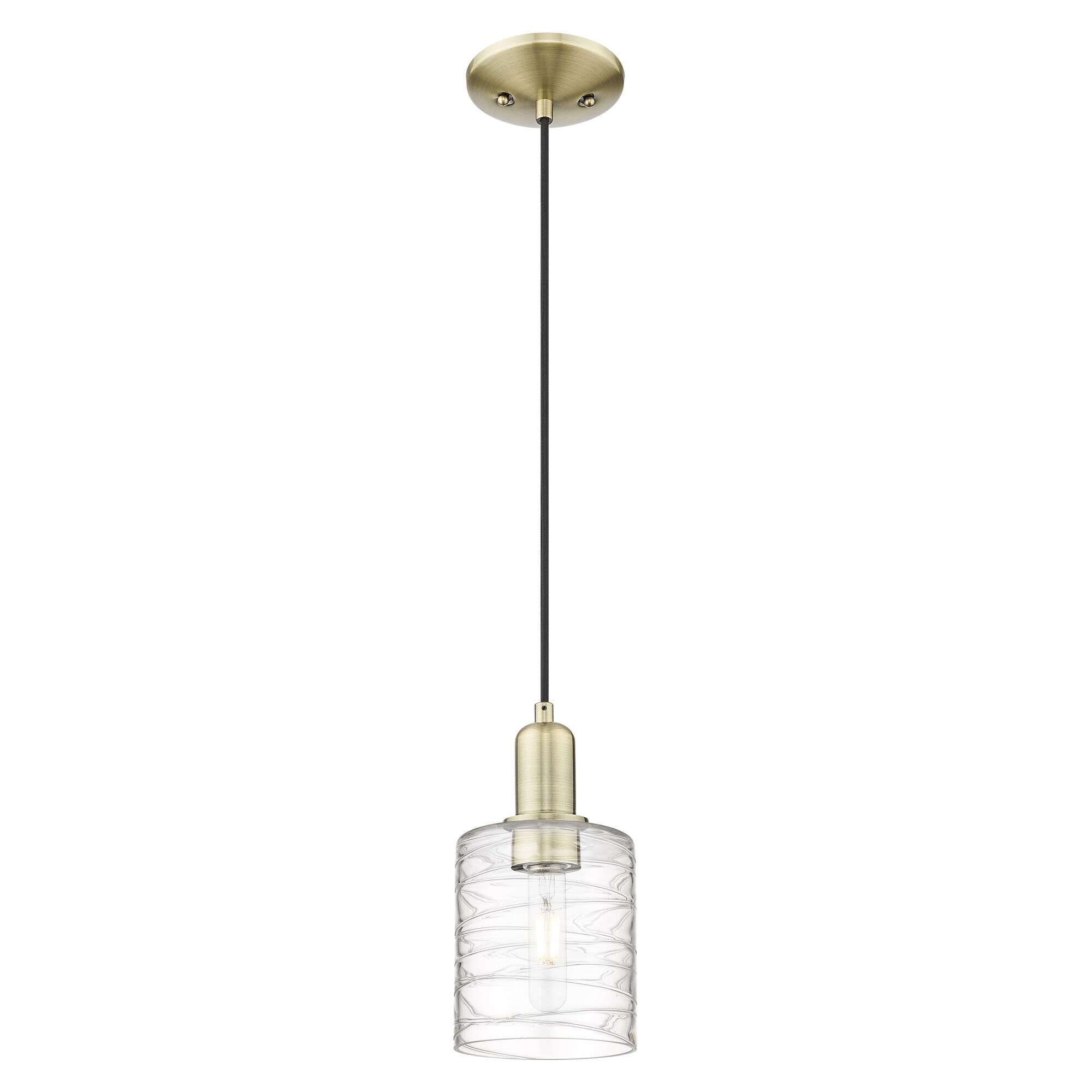 Shown in Antique Brass finish and Deco Swirl glass