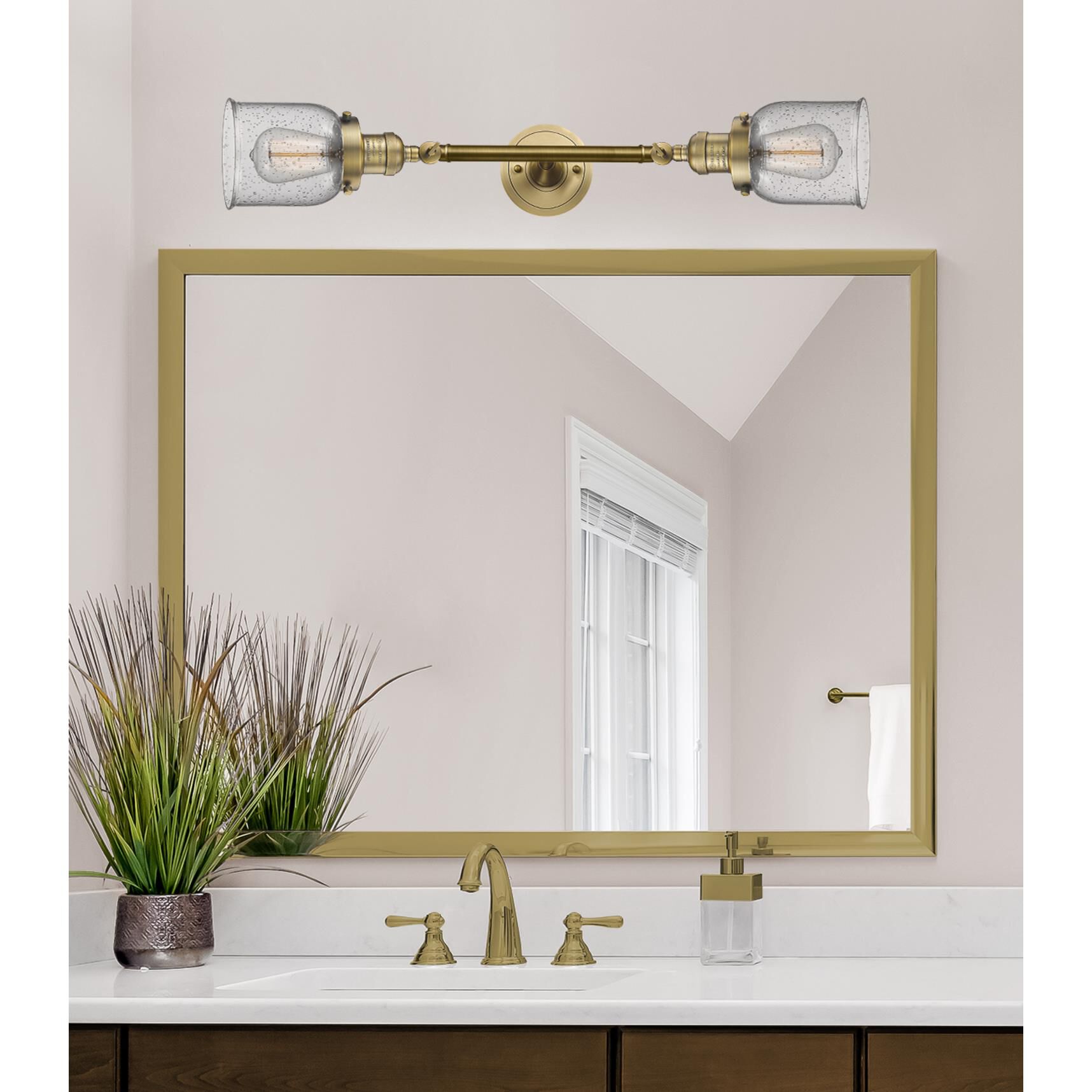 Shown in Brushed Brass finish and Seedy glass
