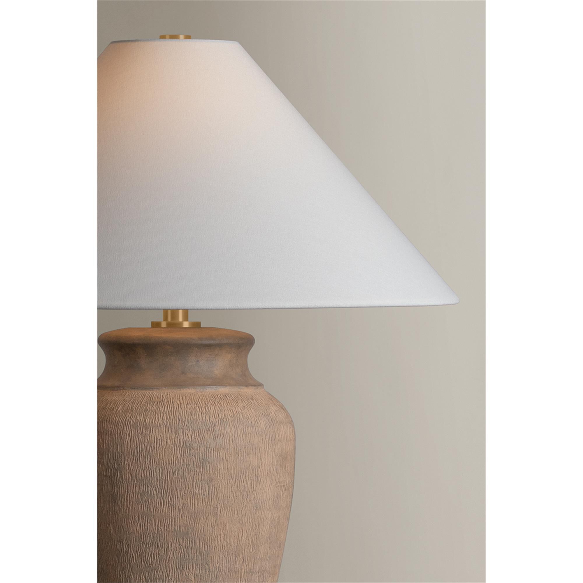 Shown in Patina Brass and Ceramic Textural Umber finish and Off White Linen shade