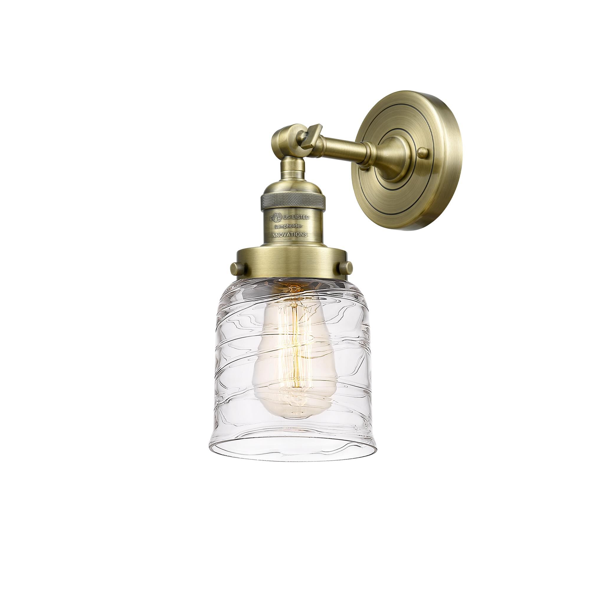 Shown in Antique Brass finish and Deco Swirl glass
