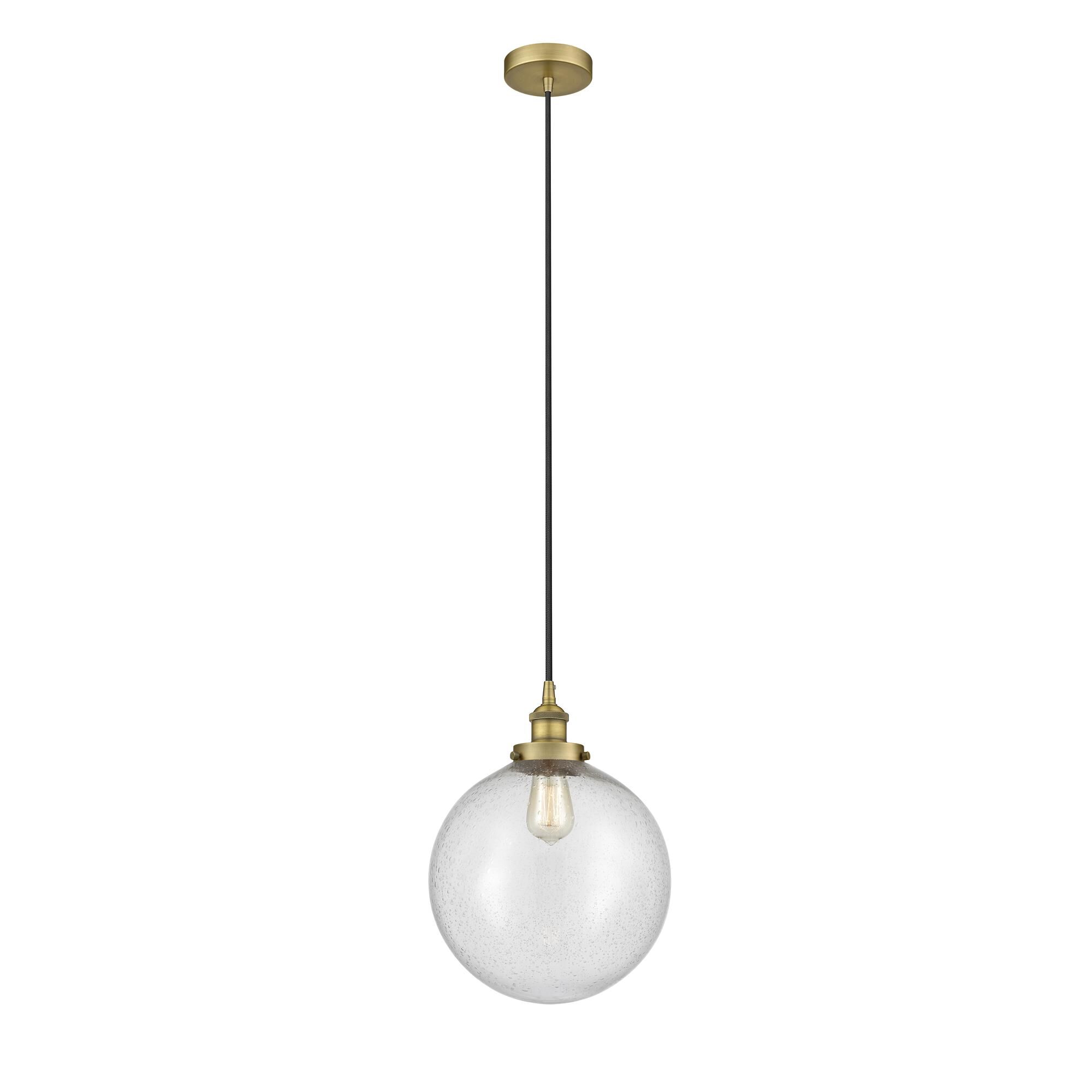Shown in Brushed Brass finish and Seedy Beacon glass