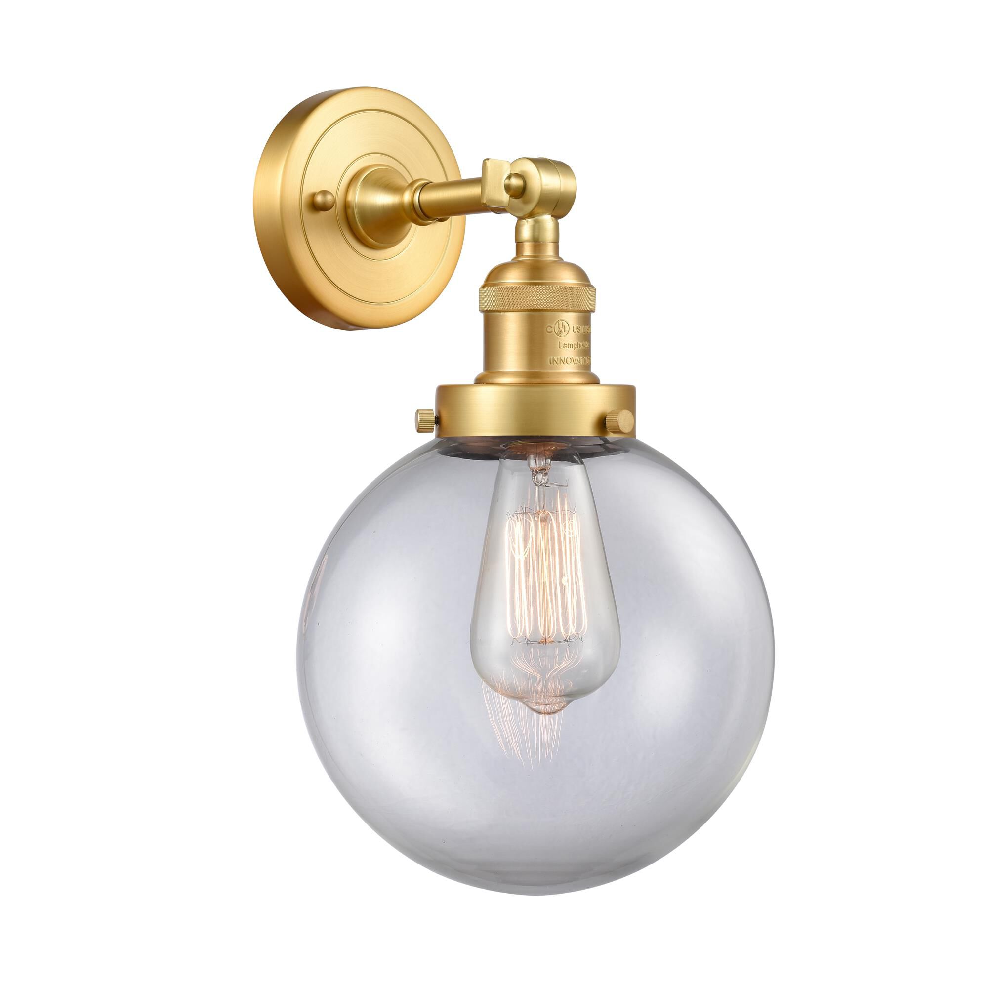 Shown in Satin Gold finish and Clear Beacon glass