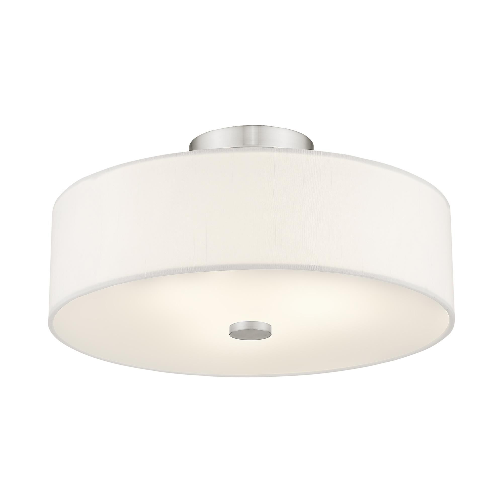 Shown in Brushed Nickel finish and Hand Crafted Off-White Fabric Hardback shade