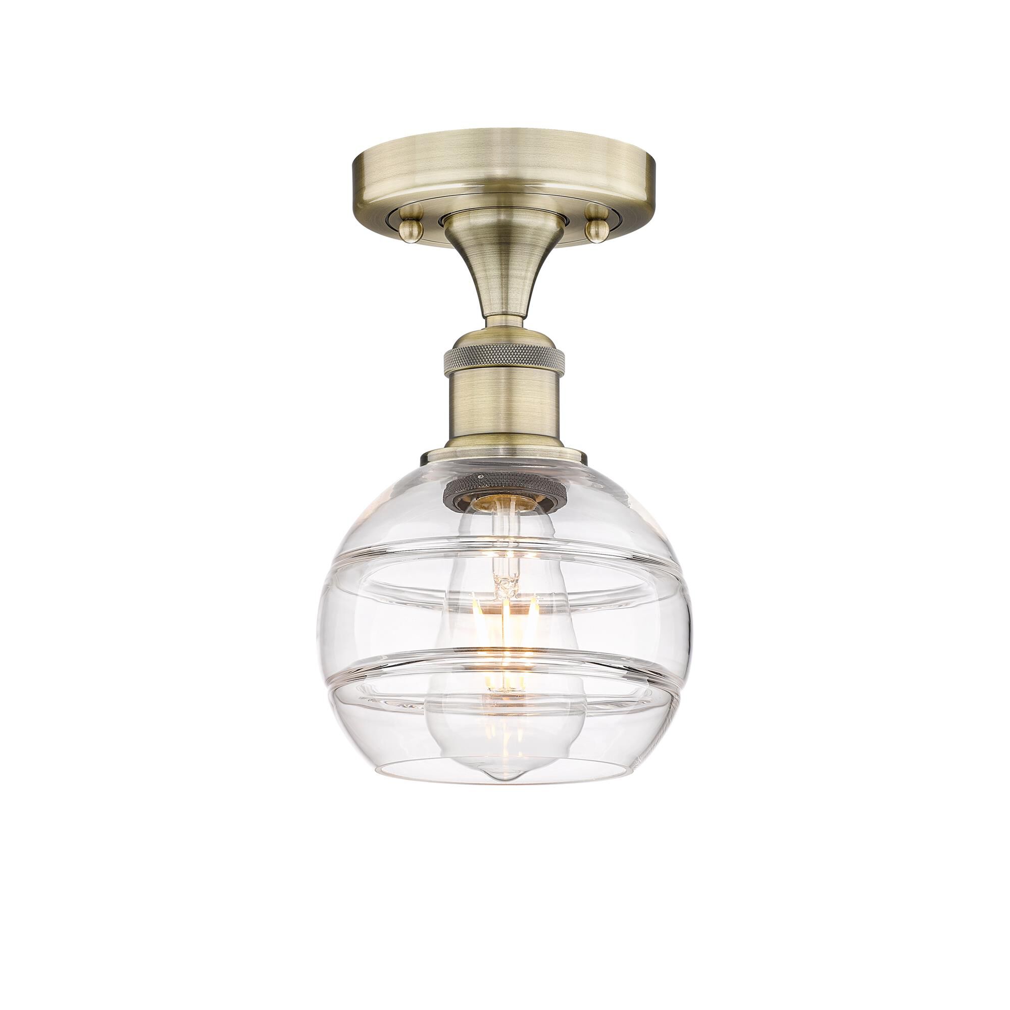 Shown in Antique Brass finish and Clear glass