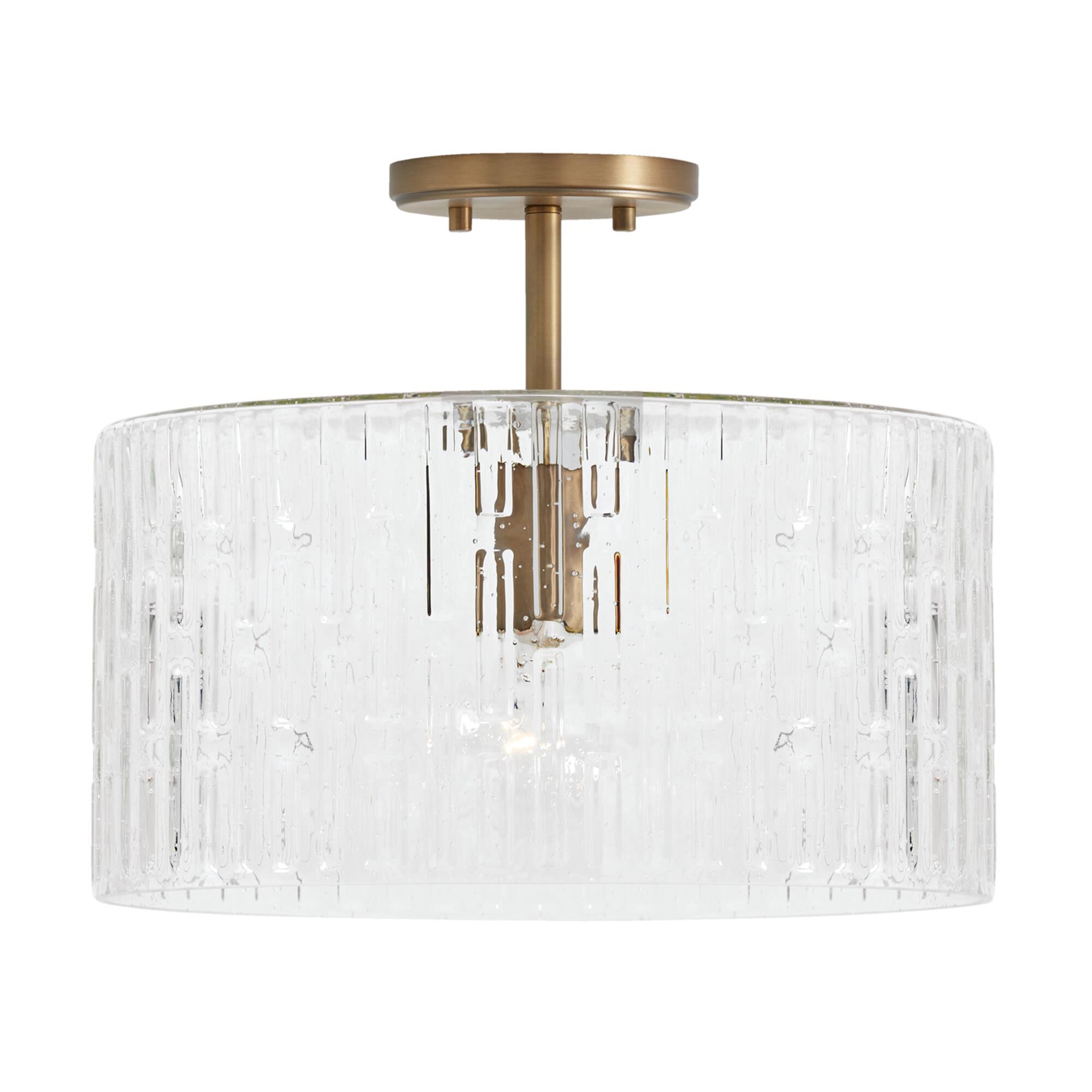 Shown in Aged Brass finish and Embossed Seeded glass