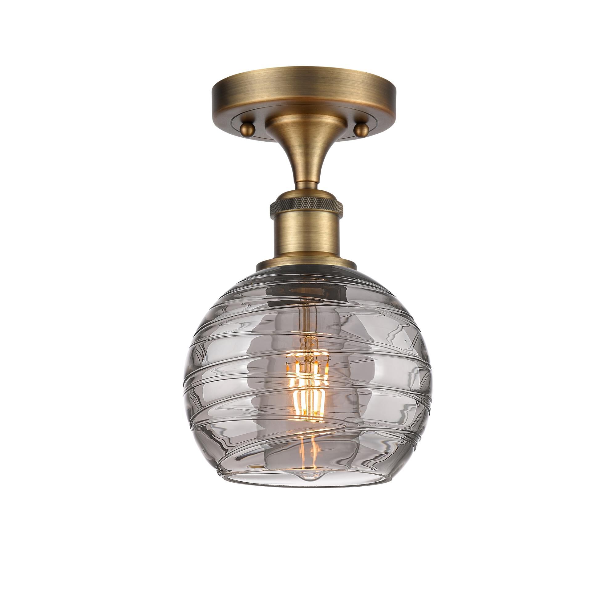 Shown in Brushed Brass finish and Light Smoke Deco Swirl glass