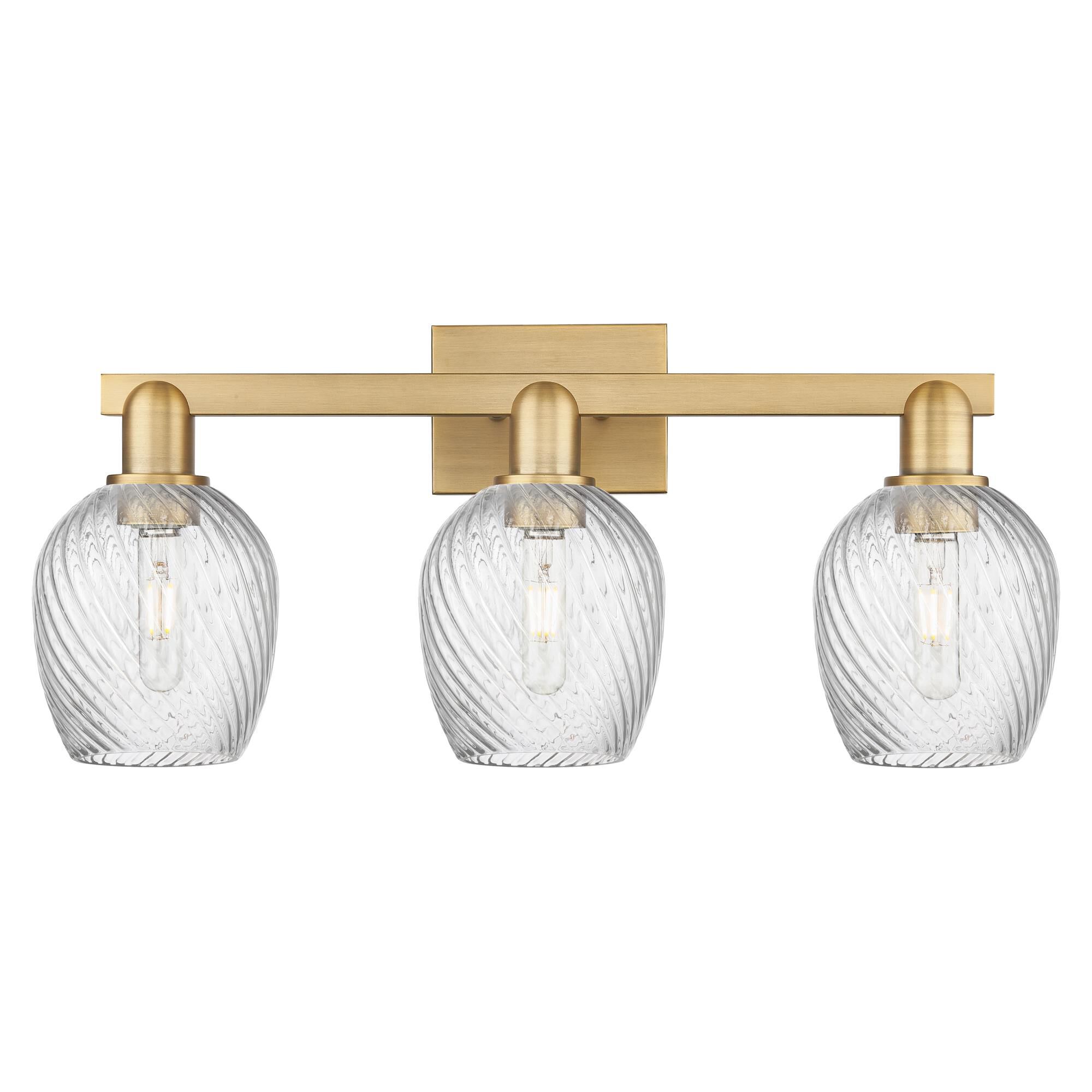 Shown in Brushed Brass finish and Clear Spiral Fluted glass