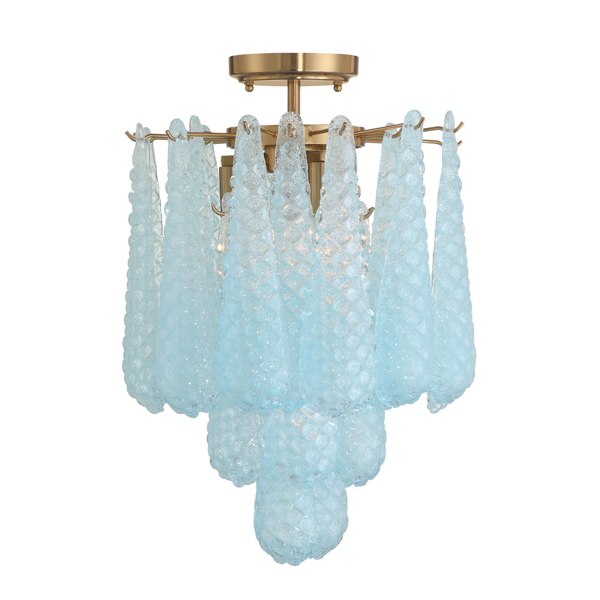 Shown in Aged Brass finish and Sand Blue glass