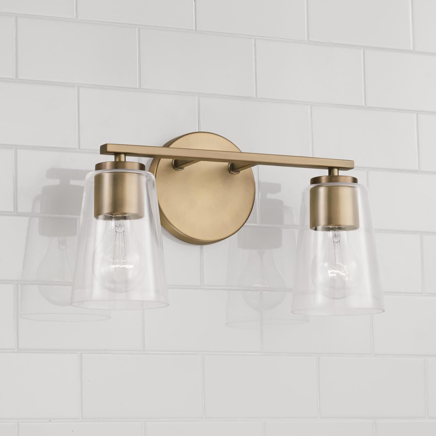 Shown in Aged Brass finish and Clear glass