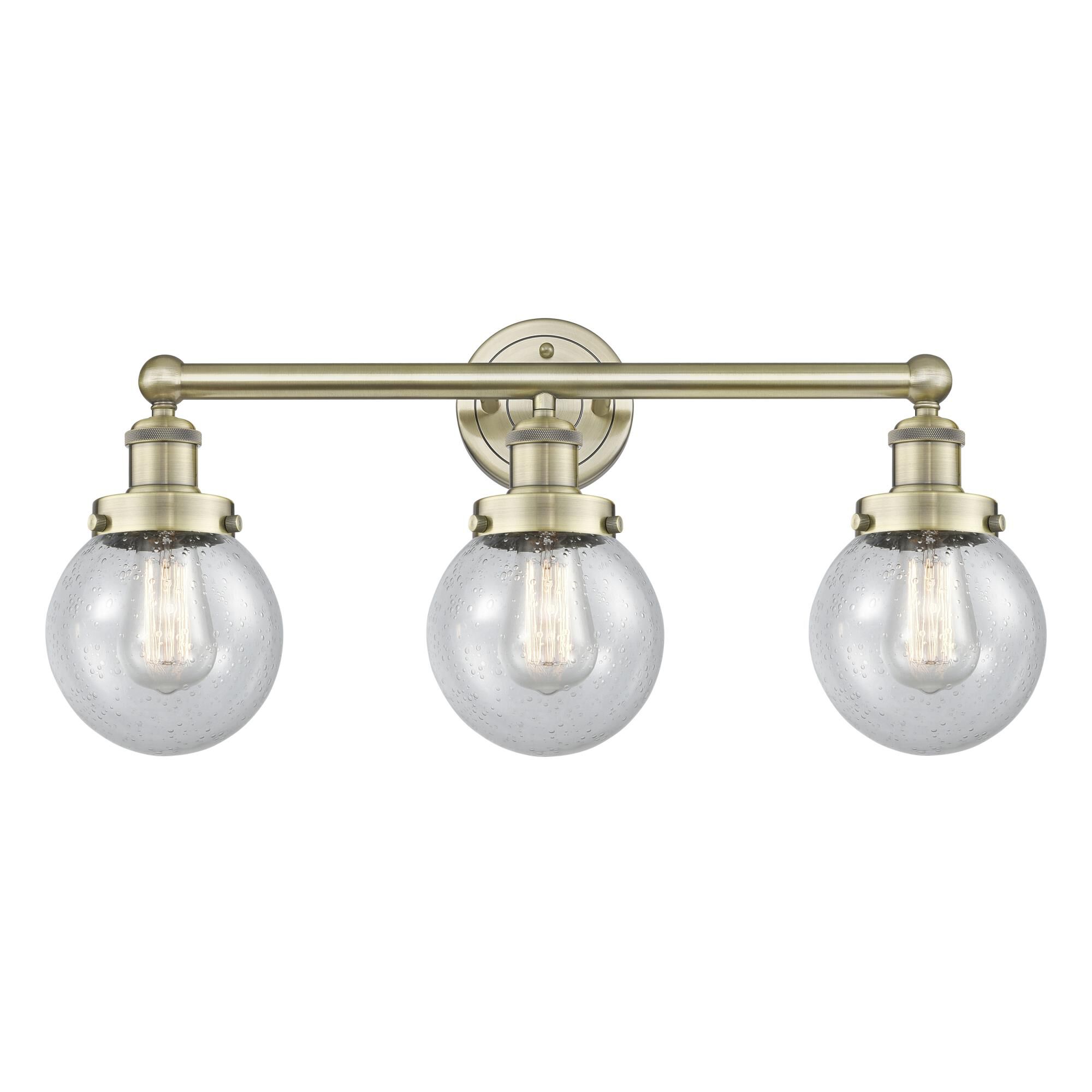 Shown in Antique Brass finish and Seedy glass