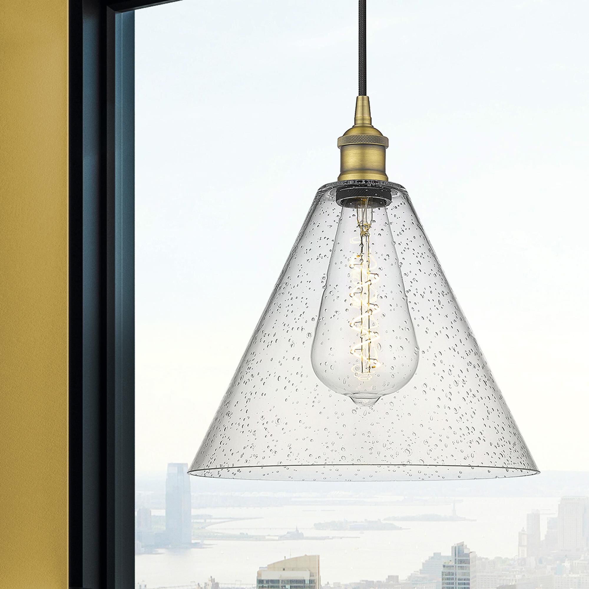 Shown in Brushed Brass finish and Seedy glass