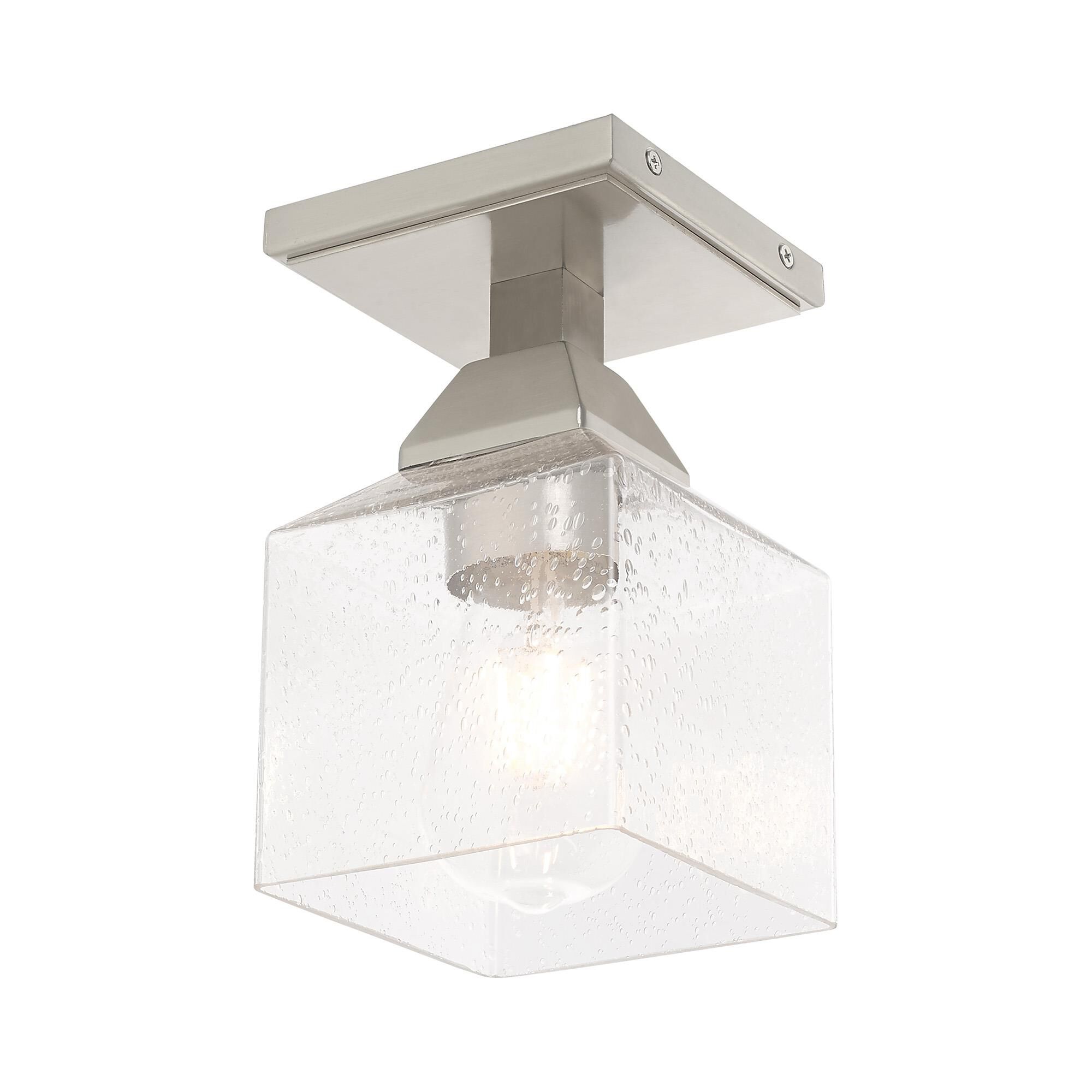 Shown in Brushed Nickel finish and Hand Blown Clear Seeded glass
