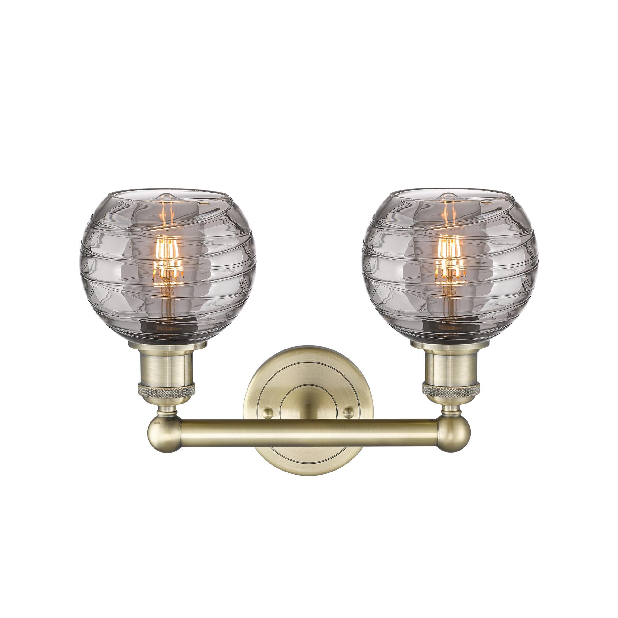 Shown in Antique Brass finish and Light Smoke Deco Swirl glass
