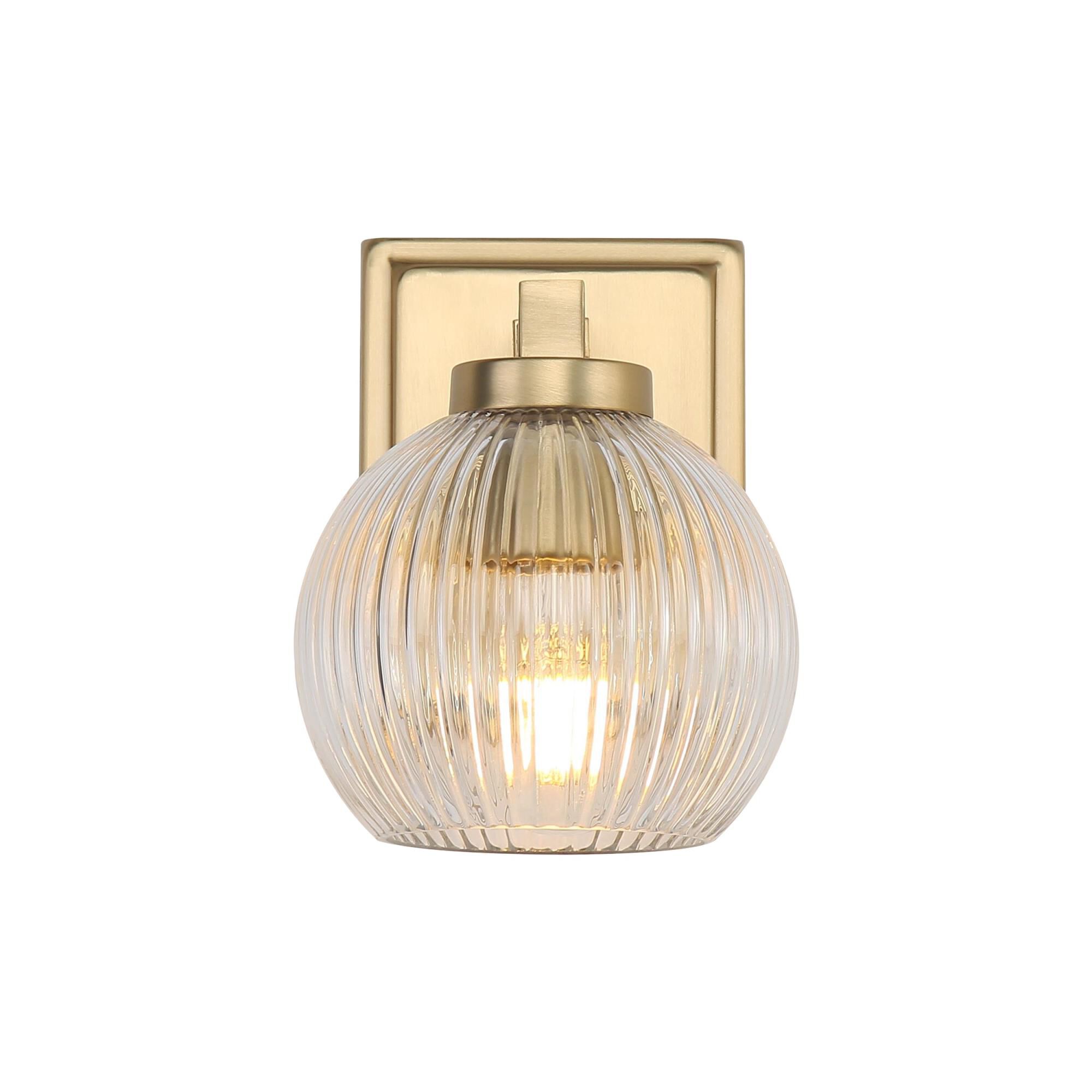 Shown in Brushed Champagne Bronze finish and Ribbed Clear Glass shade