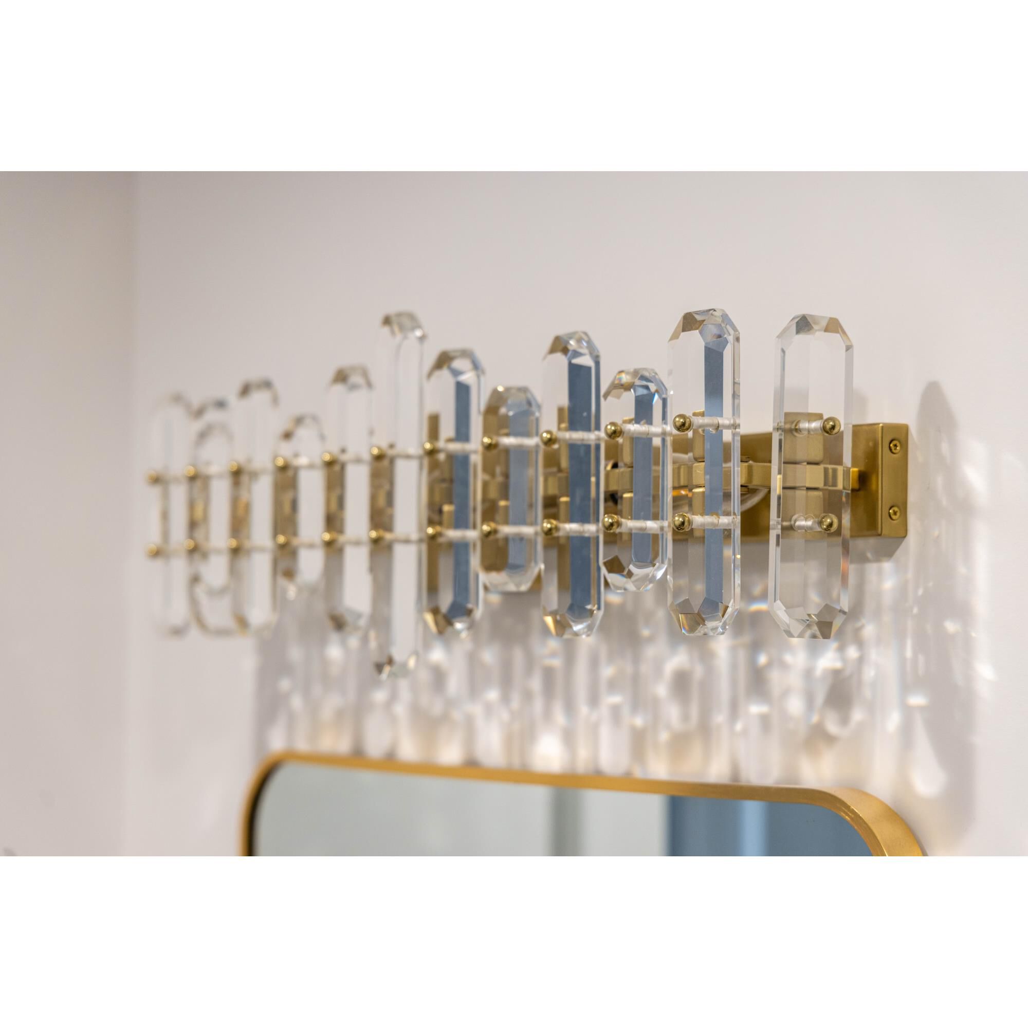 Shown in Aged Brass finish and Faceted Crystal Elements crystal