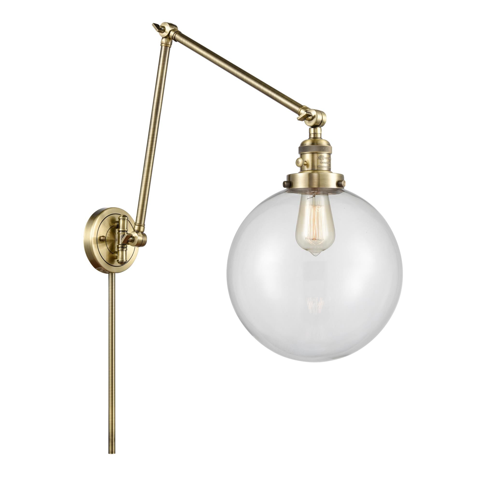 Shown in Antique Brass finish and Clear Beacon glass