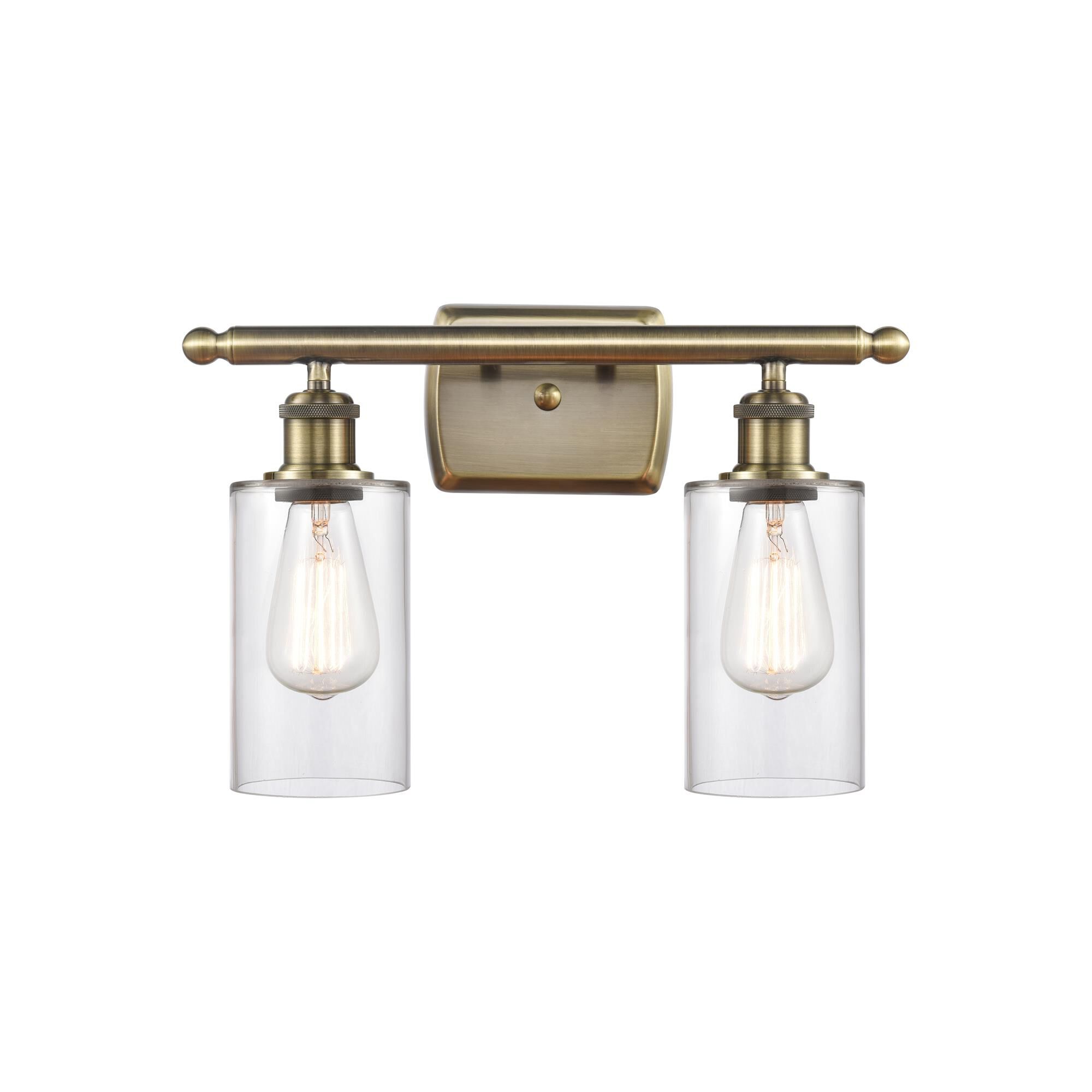 Shown in Antique Brass finish and Drum glass and Glass shade and Polished Chrome accent