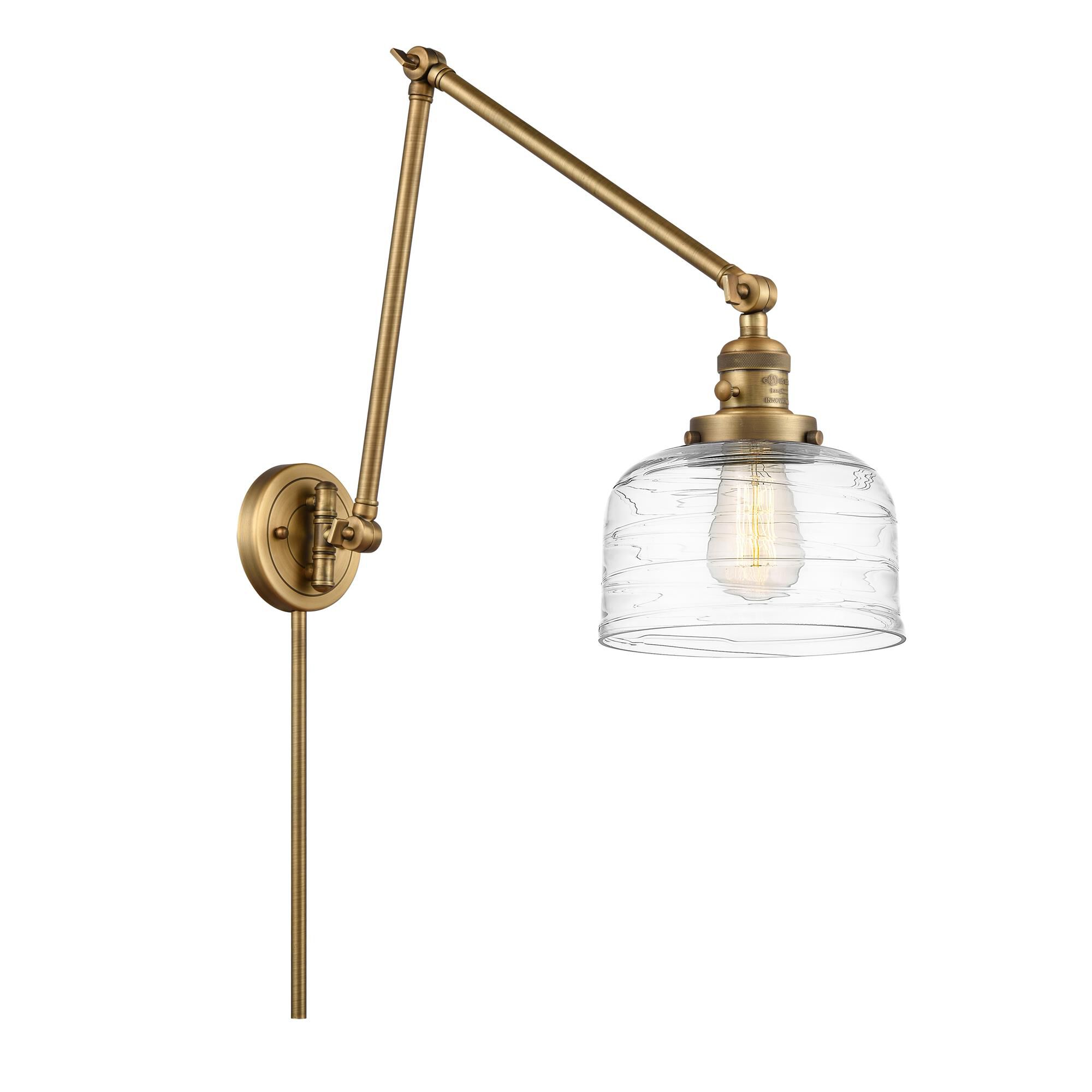 Shown in Brushed Brass finish and Clear Deco Swirl Large Bell glass