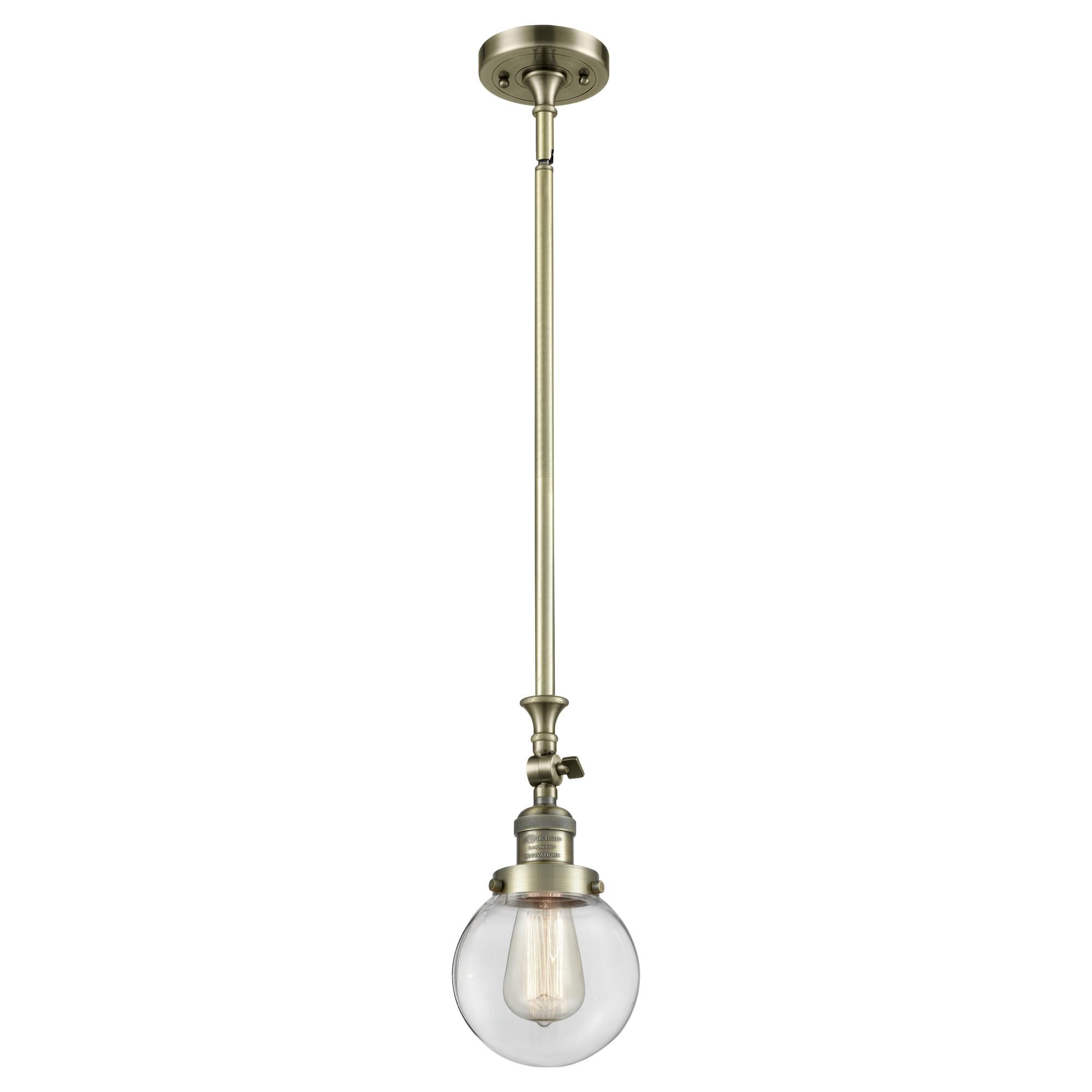 Shown in Antique Brass finish and Clear glass