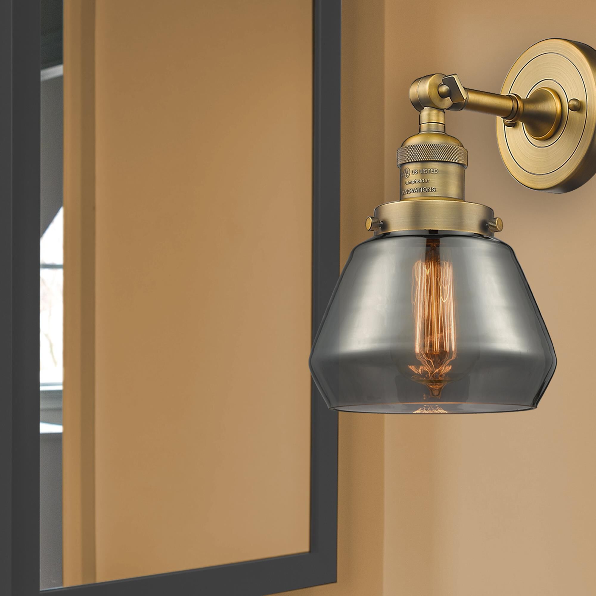 Shown in Brushed Brass finish and Plated Smoked glass
