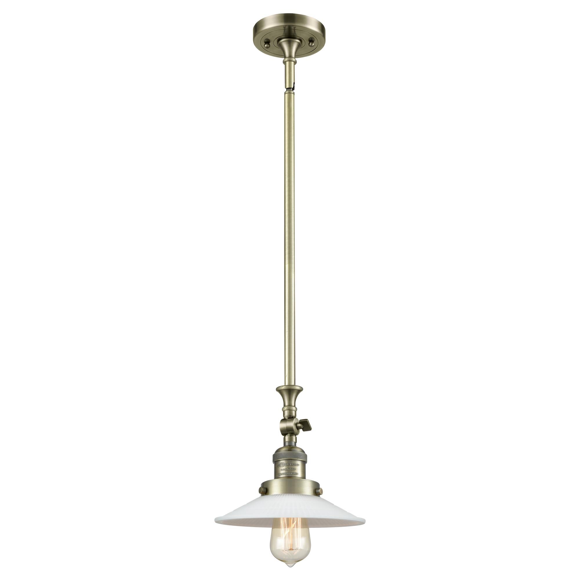 Shown in Antique Brass finish and Matte White Halophane - Cone glass