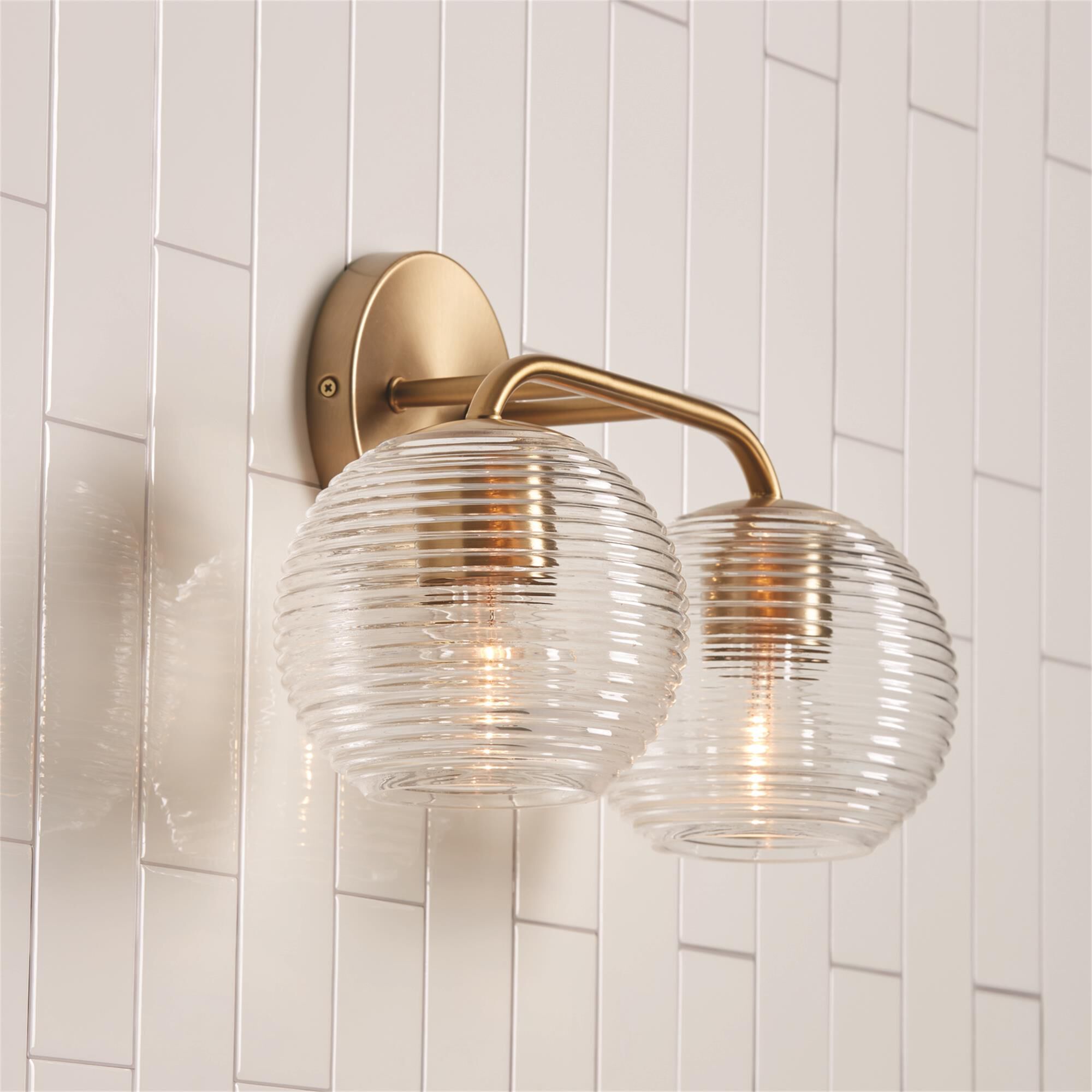 Shown in Matte Brass finish and Clear Ribbed glass
