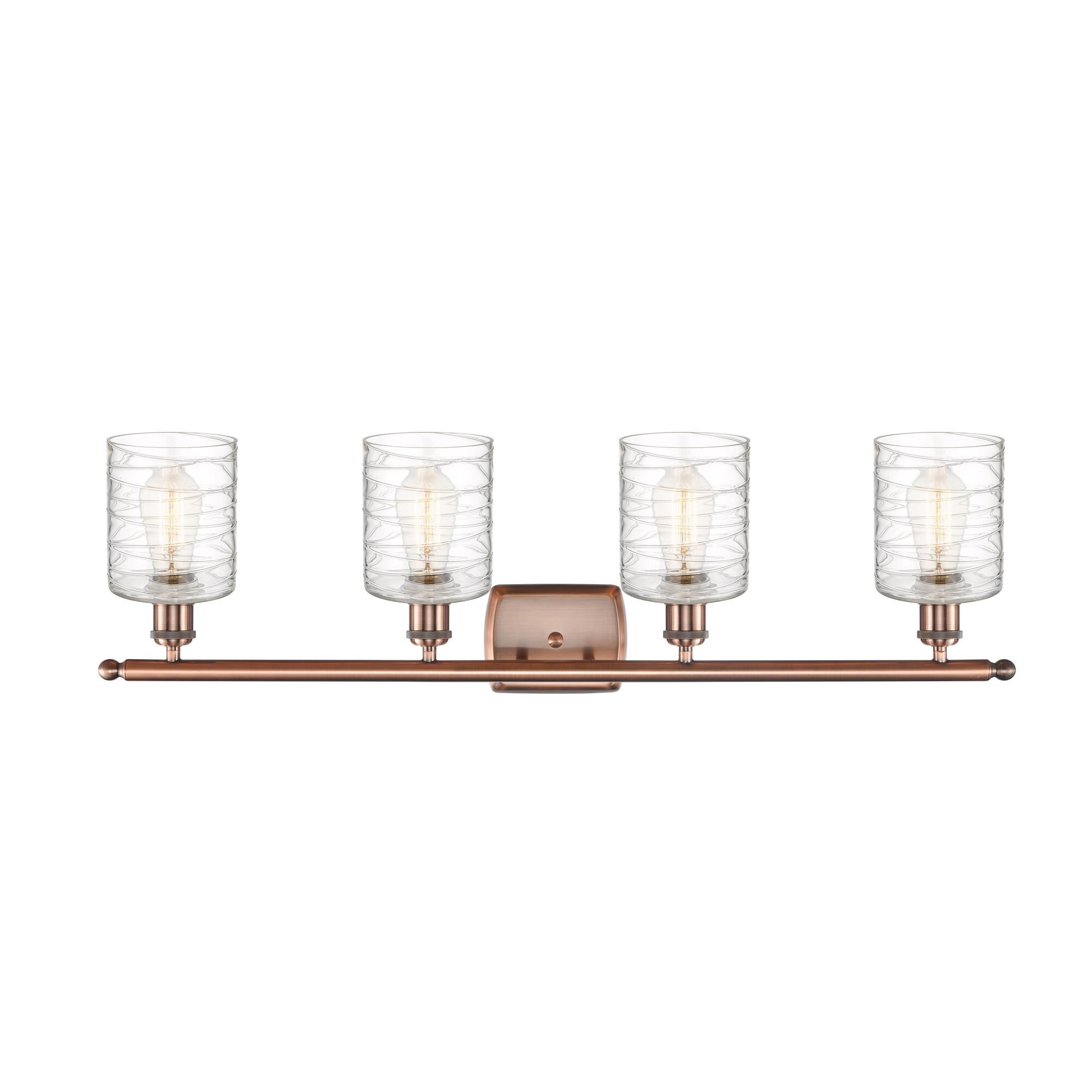Shown in Antique Copper finish and Deco Swirl glass