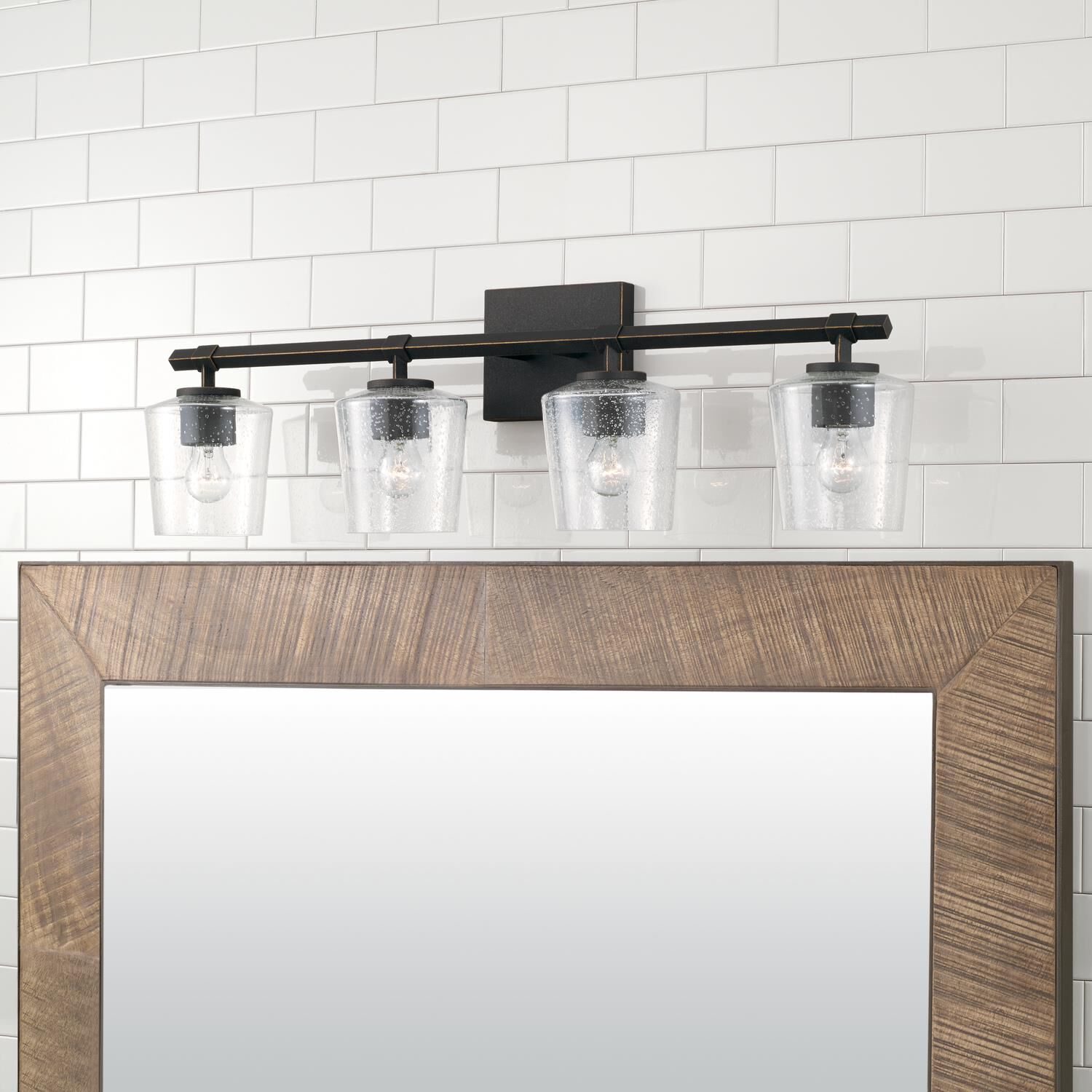 Shown in Brushed Black Iron finish and Clear Seeded glass