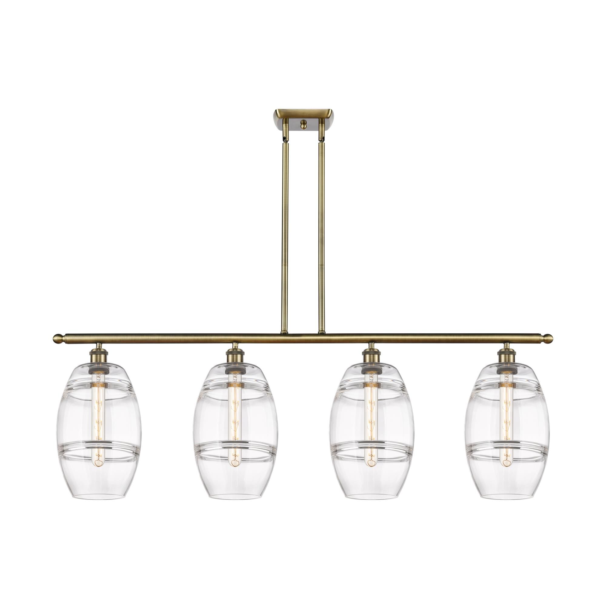 Shown in Antique Brass finish and Clear glass