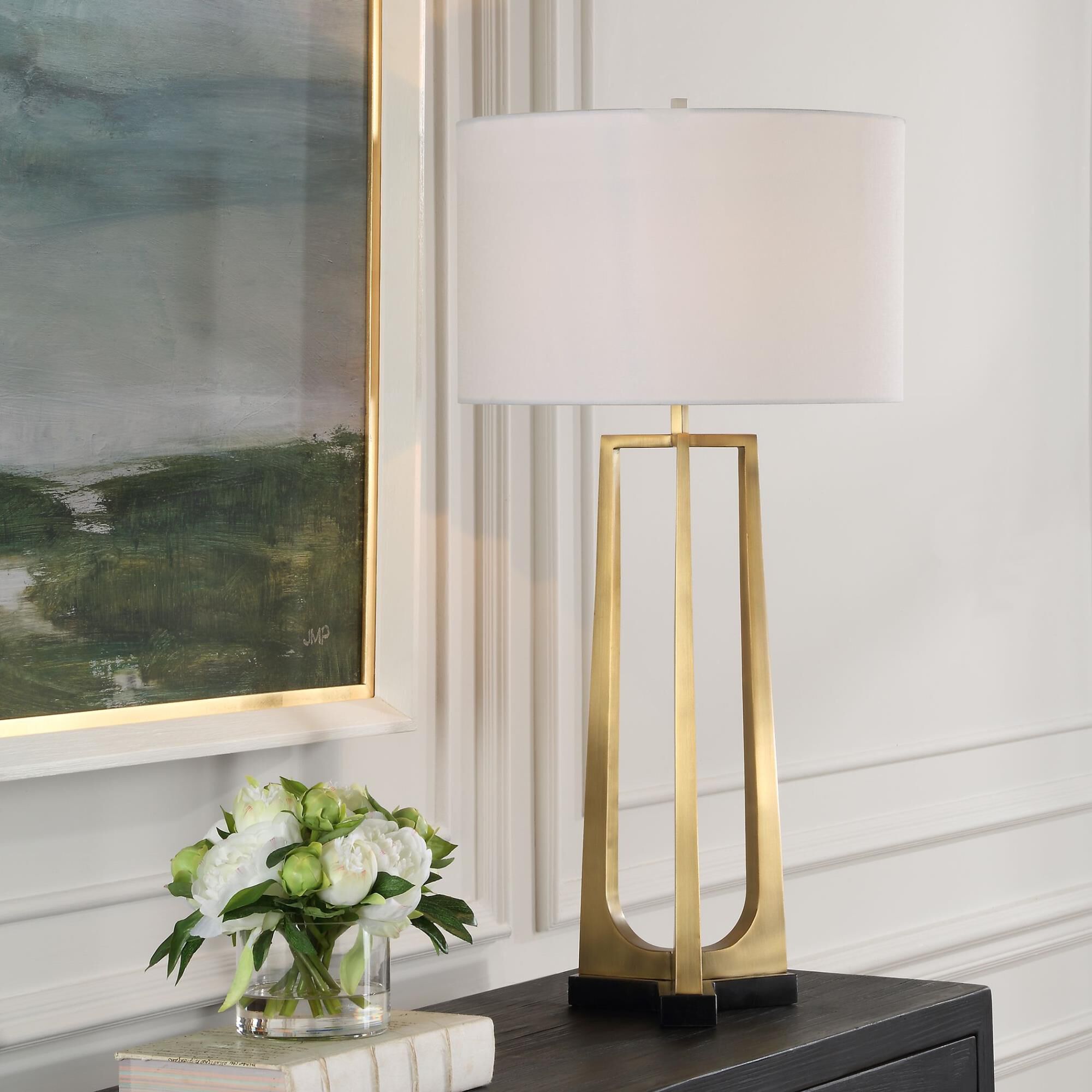 Shown in This Table Lamp Features A Sleek Iron Base With Three Tapered Legs Finished In Plated Antique Brass, finish and Round Drum Hardback shade
