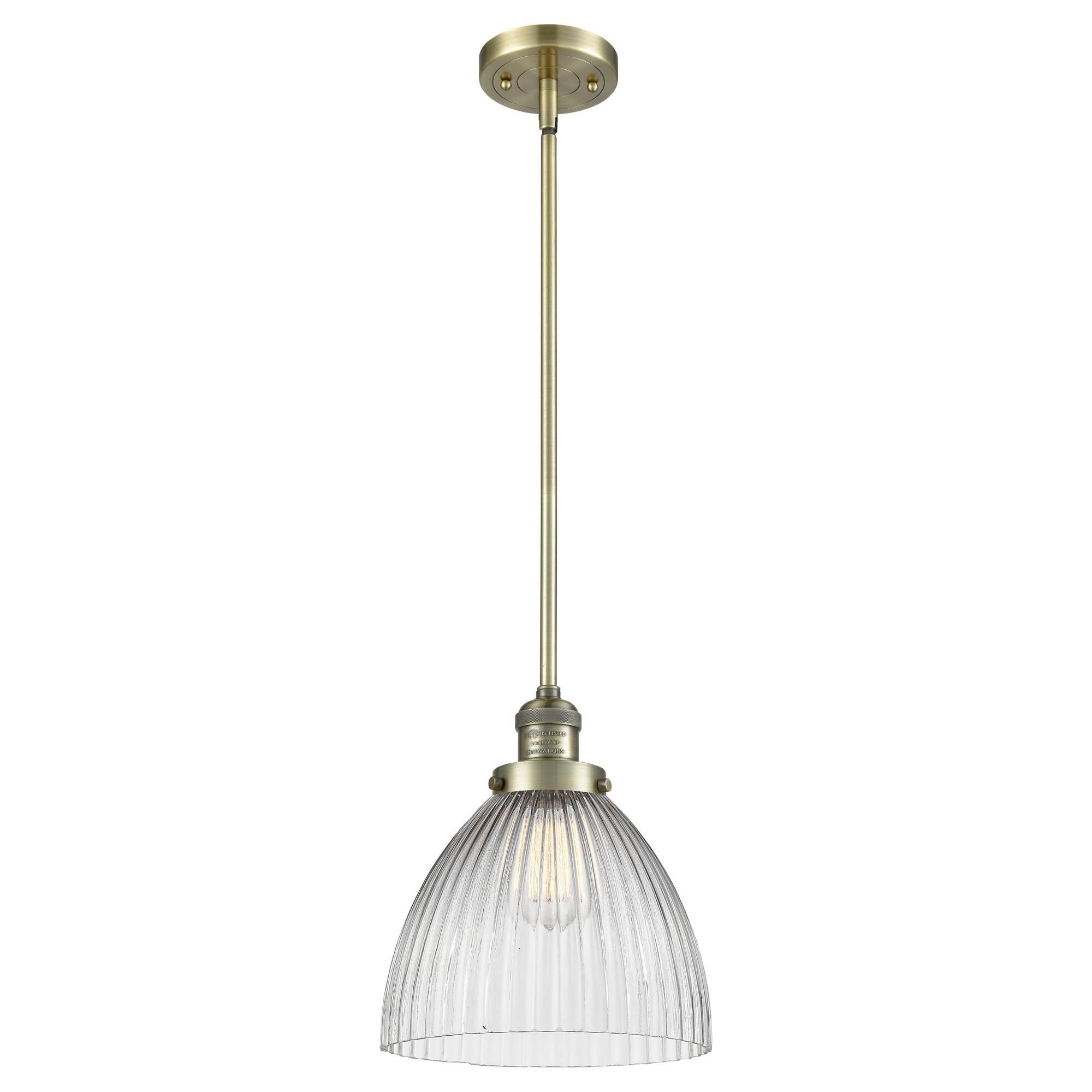 Shown in Antique Brass finish and Clear Halophane glass