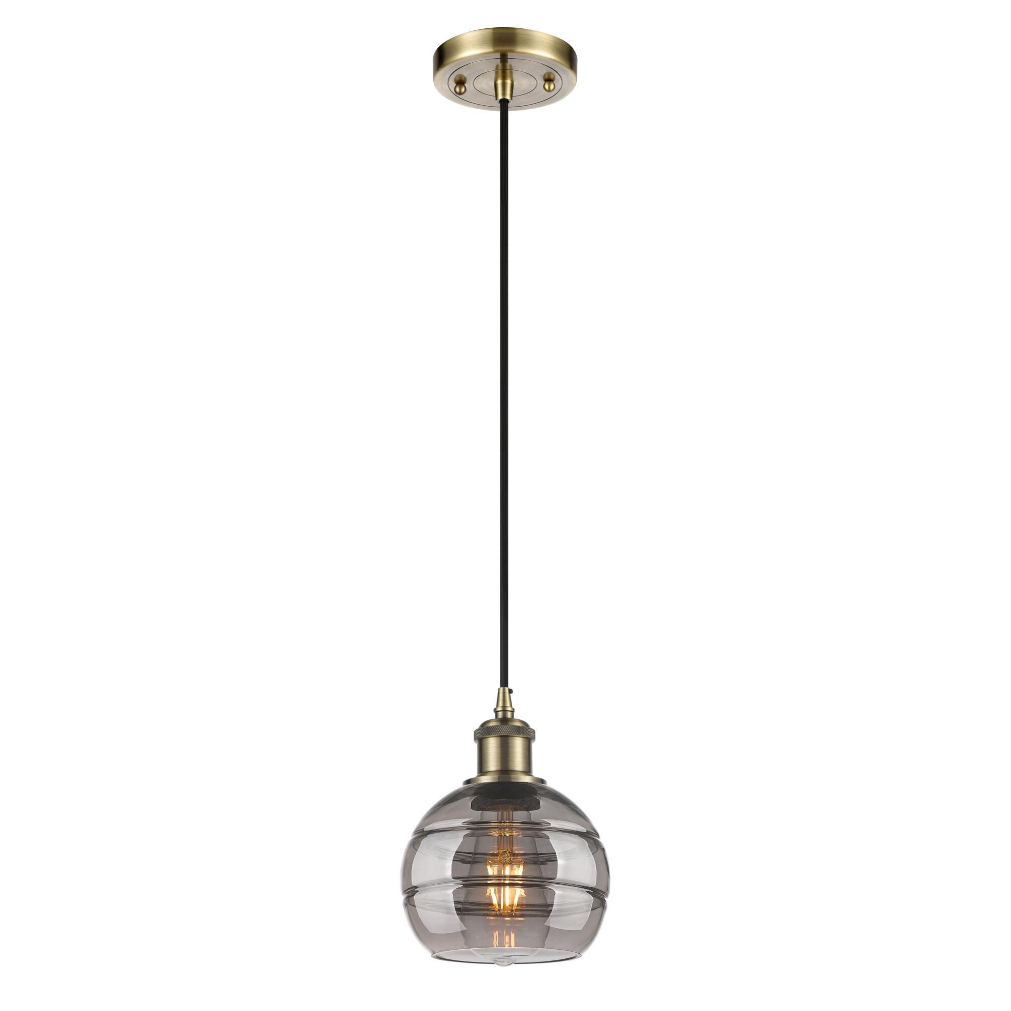 Shown in Antique Brass finish and Light Smoke glass