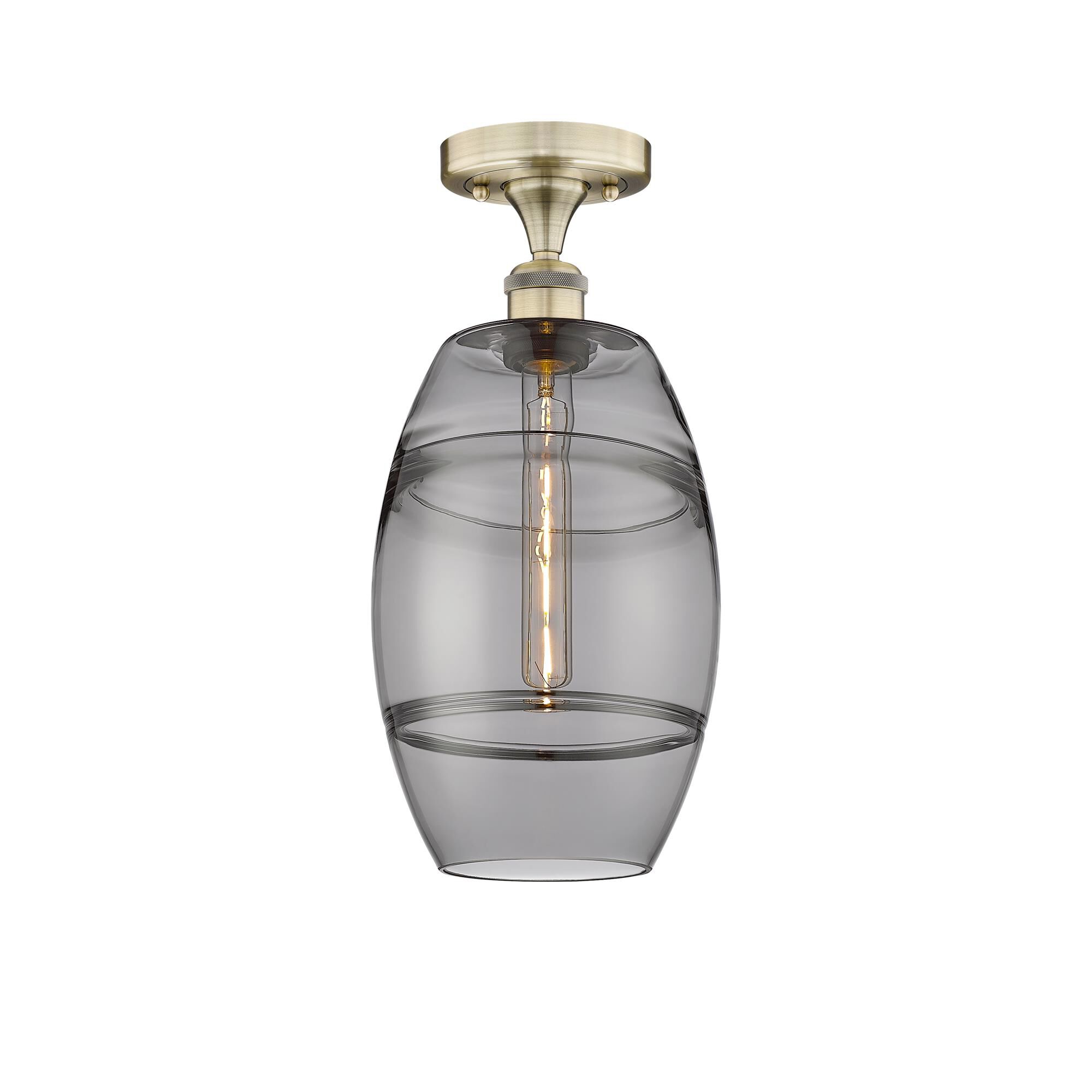 Shown in Antique Brass finish and Light Smoke glass