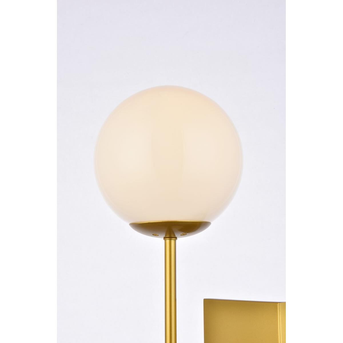 Shown in Brass finish and White glass